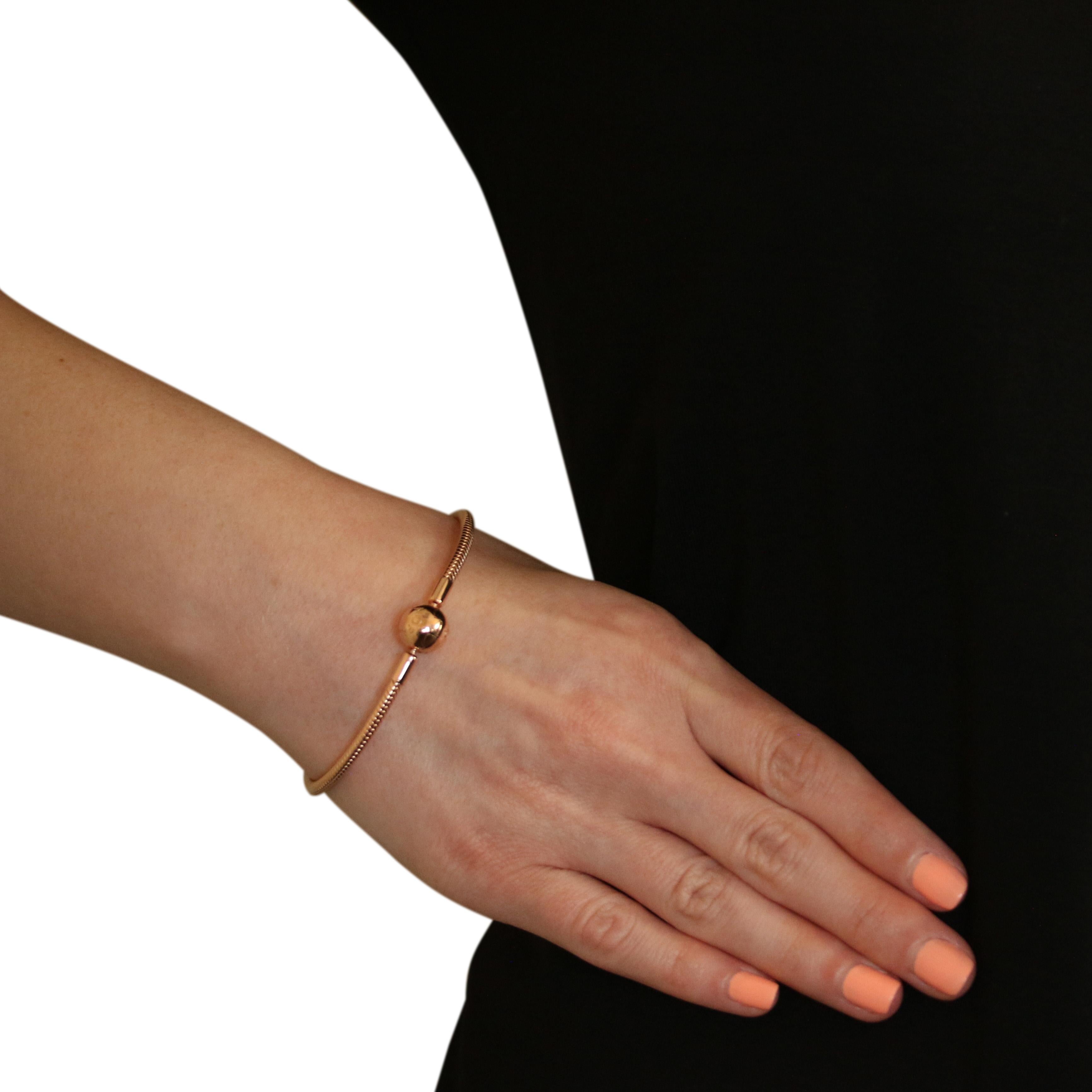 This NEW piece is guaranteed 100% authentic PANDORA, as we recently bought out an authorized PANDORA retailer.

Brand: Pandora
Number: 580728
Title: Pandora Rose Smooth Clasp Charm Bracelet

Metal Content: 14k Rose Gold Plated Sterling