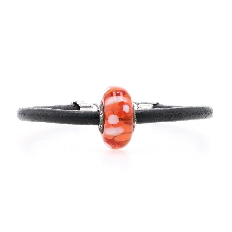 We recently bought out a jewelry store that was an authorized Pandora dealer, and this piece is guaranteed NEW and 100% authentic. 

The bracelet is a black cord which secures with a lobster claw clasp. 

A Murano glass bead is set along the cord