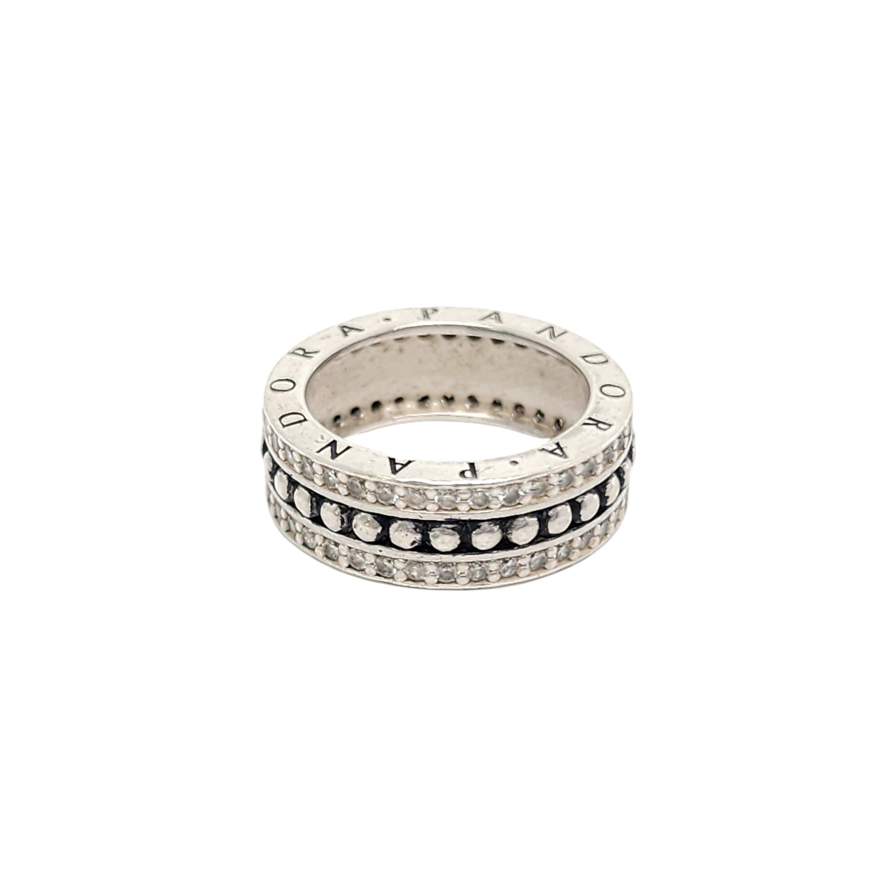 Authentic Pandora sterling silver CZ Forever ring.

Size 54 (approx 7 US)

Pandora #190962CZ

Sterling silver band with a middle bead design row and a row of CZs on the top and bottom.

Measures approx 1/4