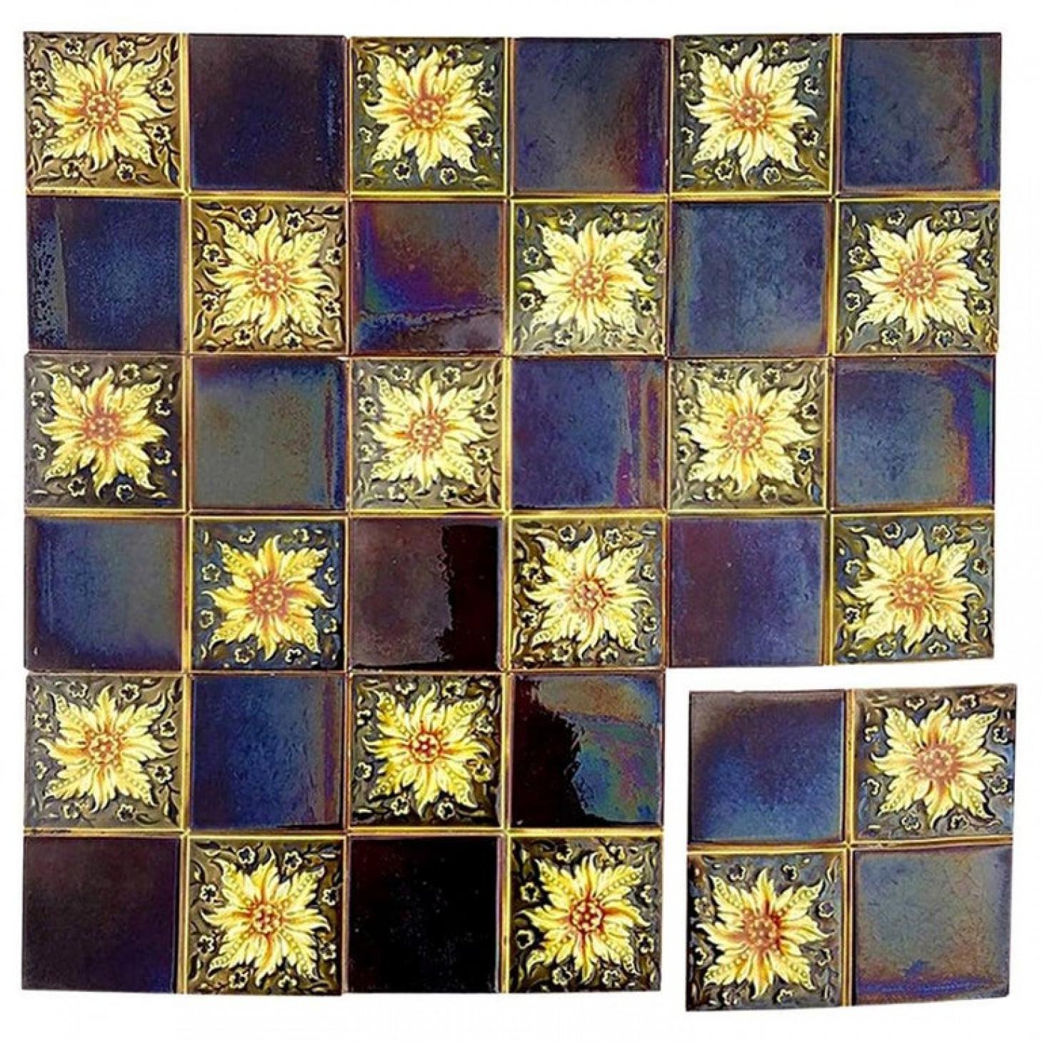 Recently lifted from its original home, a unique and antique set of Art Deco handmade tiles by S.A. Des Pavillions, Florennes. A beautiful relief and color. With stylized design. These tiles would be charming displayed on easels, framed or