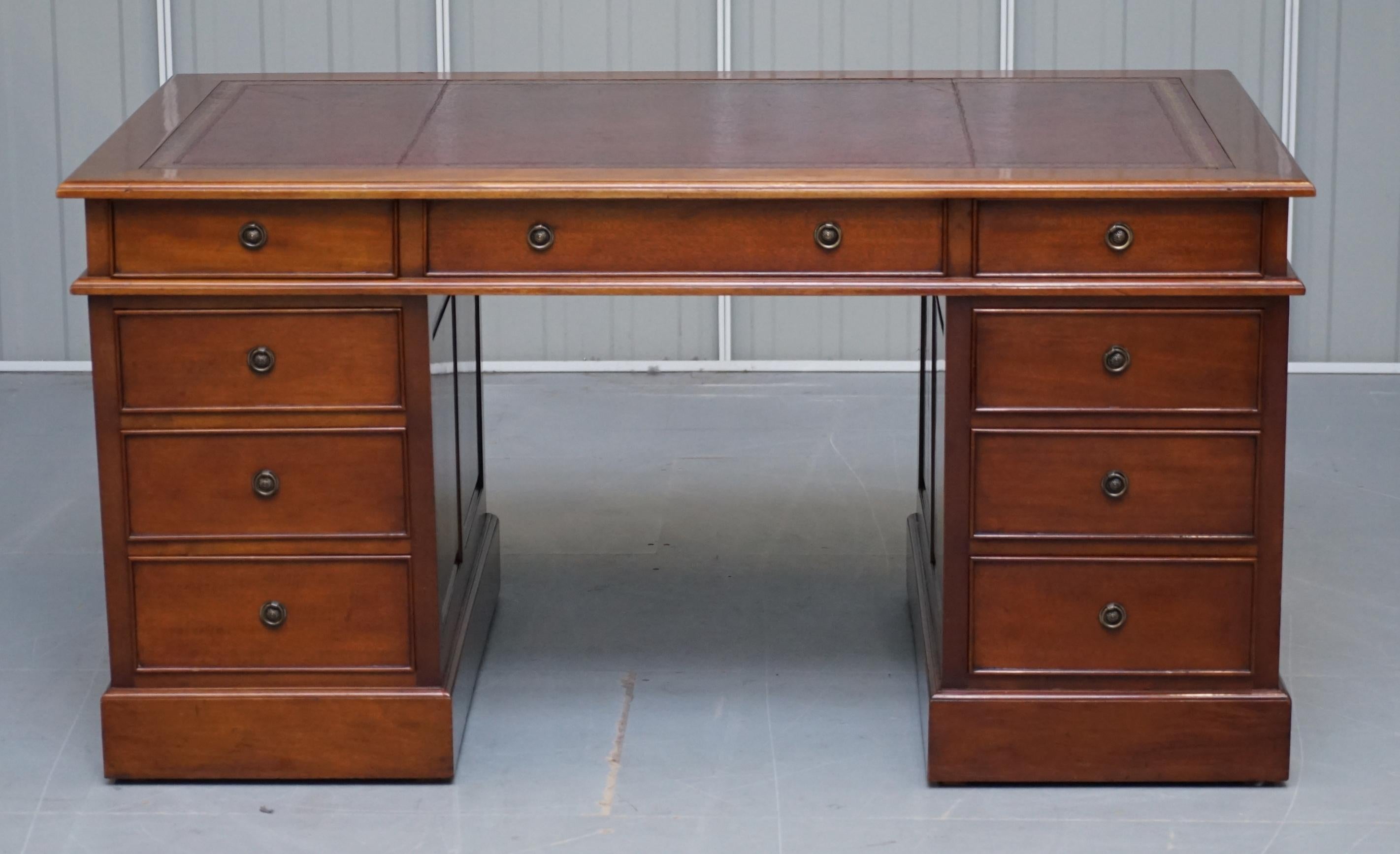 We are delighted to offer for sale this lovely panelled Cherry wood twin pedestal partner desk with oxblood leather writing surface 

A very good looking and well made desk, it has panelled sides and back, all cherry wood with an oxblood leather