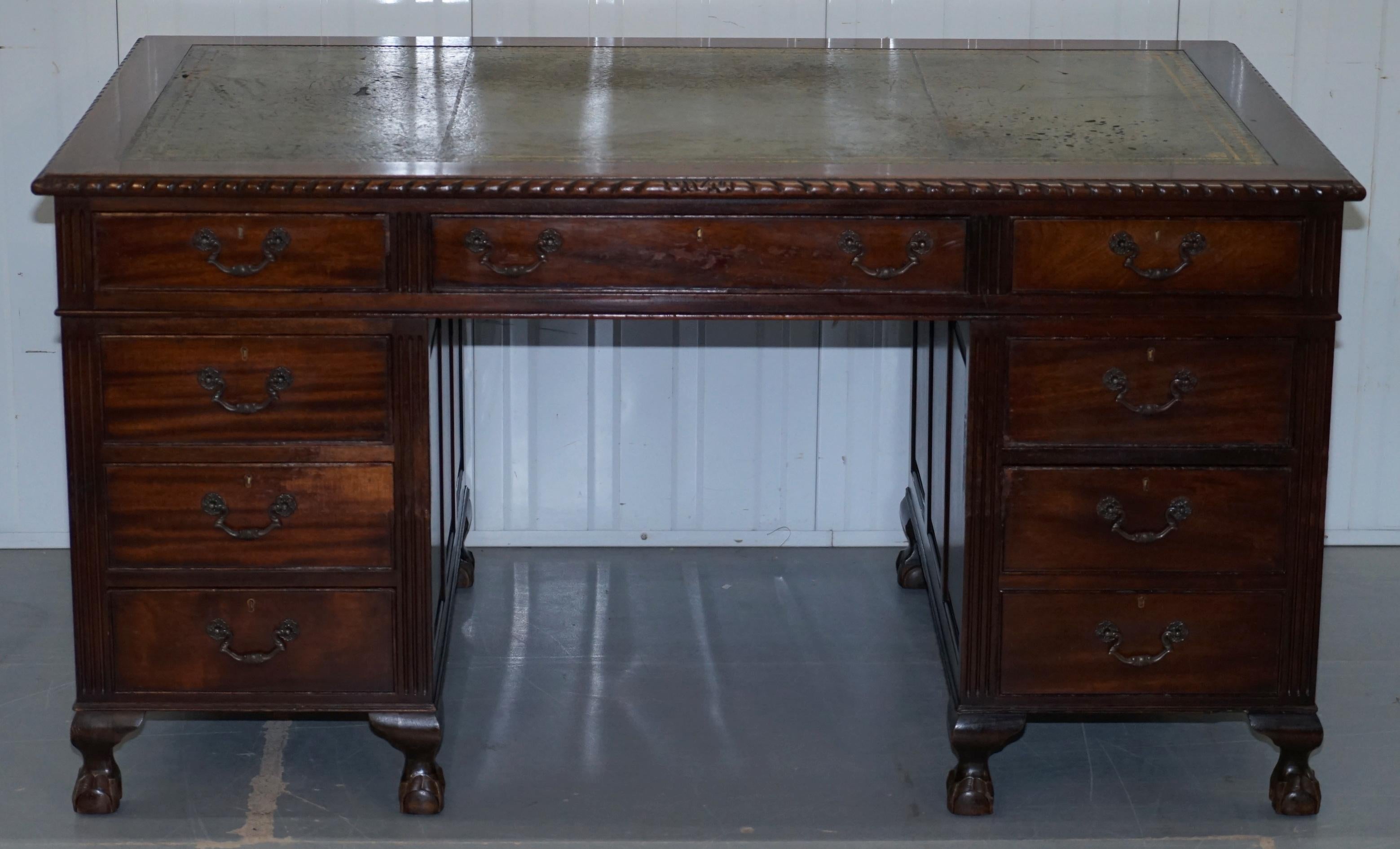 We are delighted to offer for sale this lovely large sized panelled mahogany twin pedestal partner desk with hand carved claw and ball feet

This desk is a genuine vintage piece, it’s not a modern reproduction, each pedestal is finished with