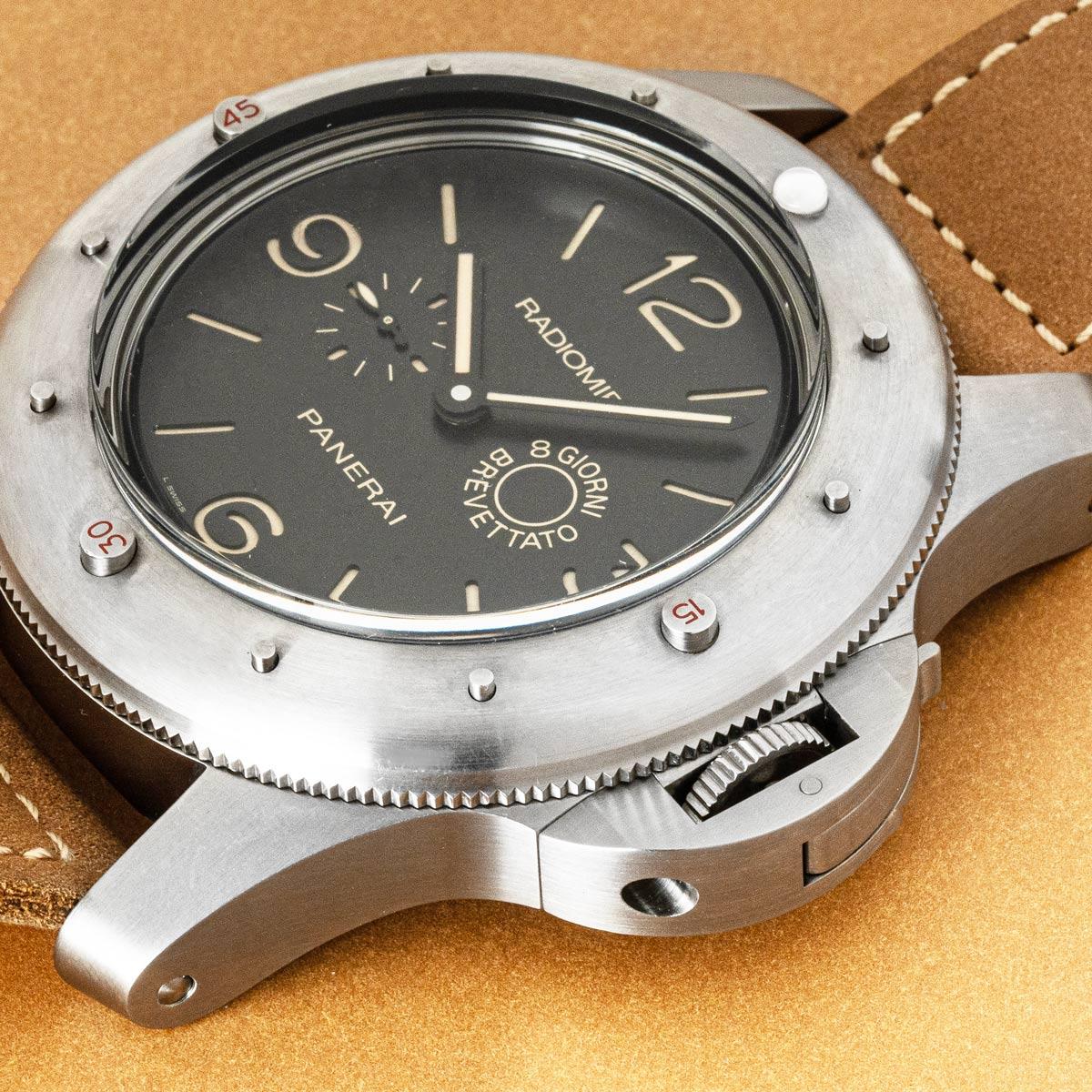 A 60mm limited edition Radiomir Egiziano in titanium by Panerai. Features a black dial indicating an 8 day power reserve at 3 o'clock and a small seconds display at 9 o'clock. Complementing the black dial is the titanium bezel and a 60mm titanium