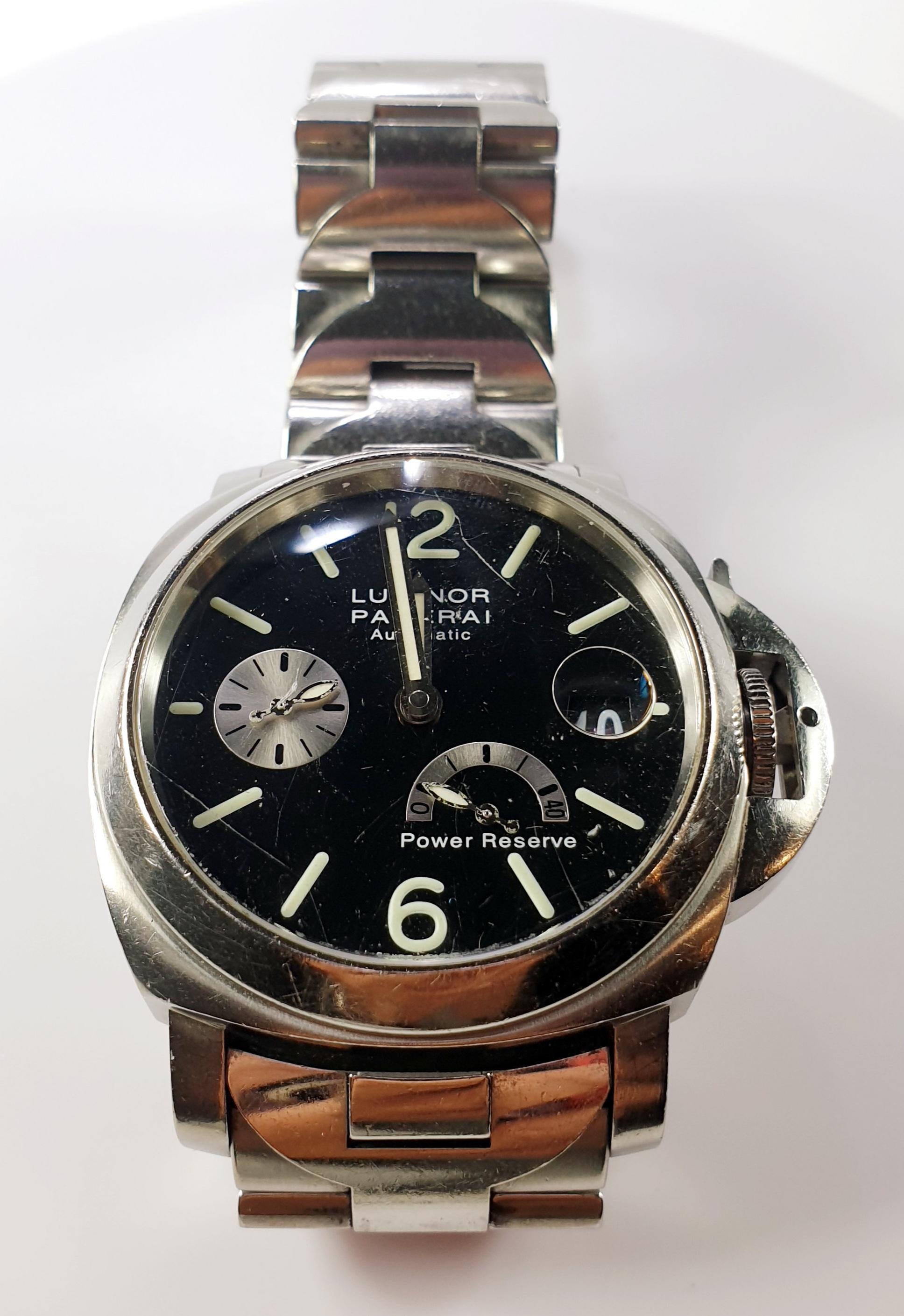 Pre-owned Panerai Luminor OP6576 automatic watch. 
Luminor Authomatic  Firenze 1860  Power Reserve Swiss Made 44mm Watch 
The timepiece has Minor damage on the dial as it shows on an additional picture. It is completed with a stainless steel band