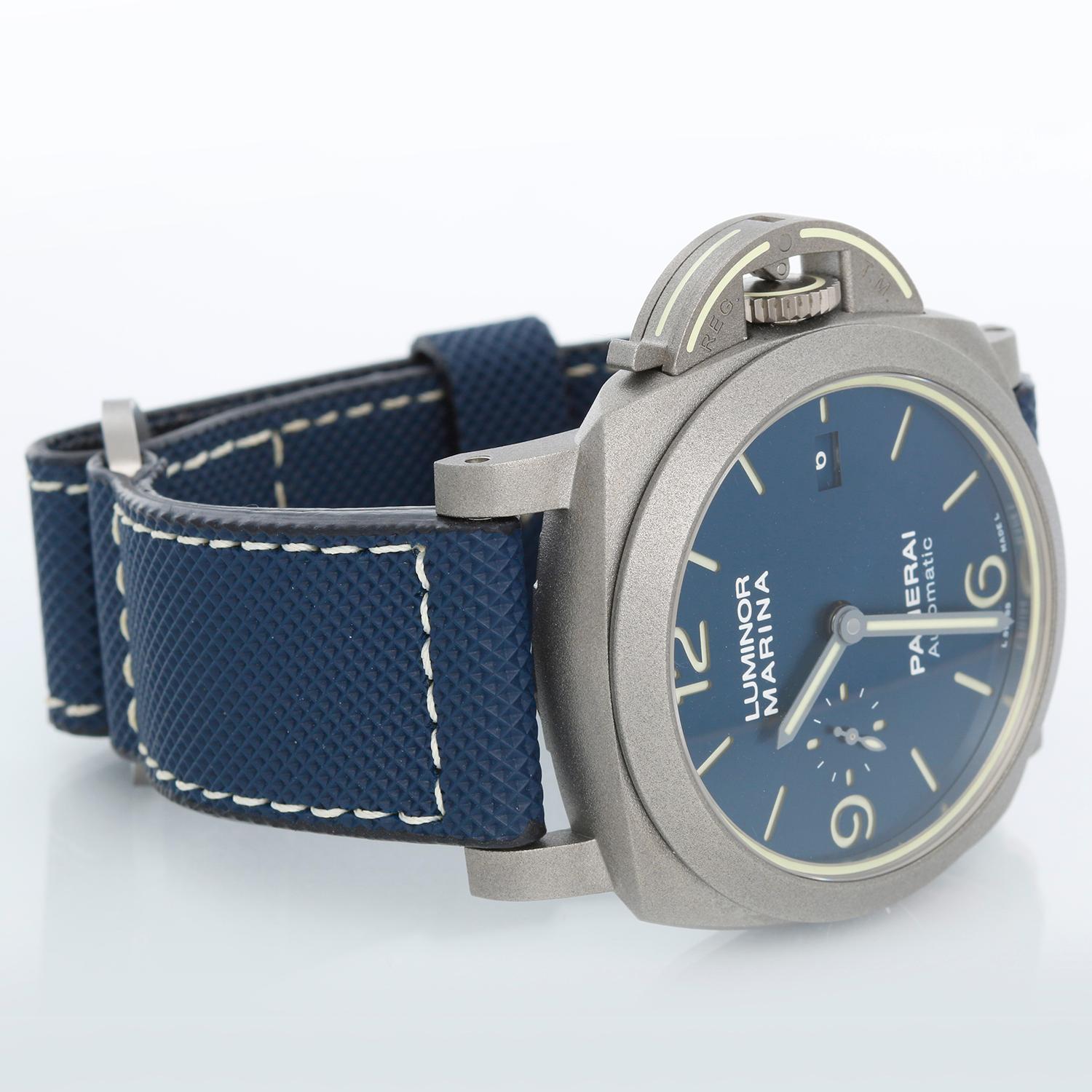Panerai Luminor Marina 44mm PAM 0117 (70 YEAR WARRANTY) - Automatic winding. Titanium watch with smooth bezel ( 44 mm ). Luminous crown guard. Blue sun-brushed with luminous Arabic numerals and hour markers. Date at 3 o'clock and small seconds at 9