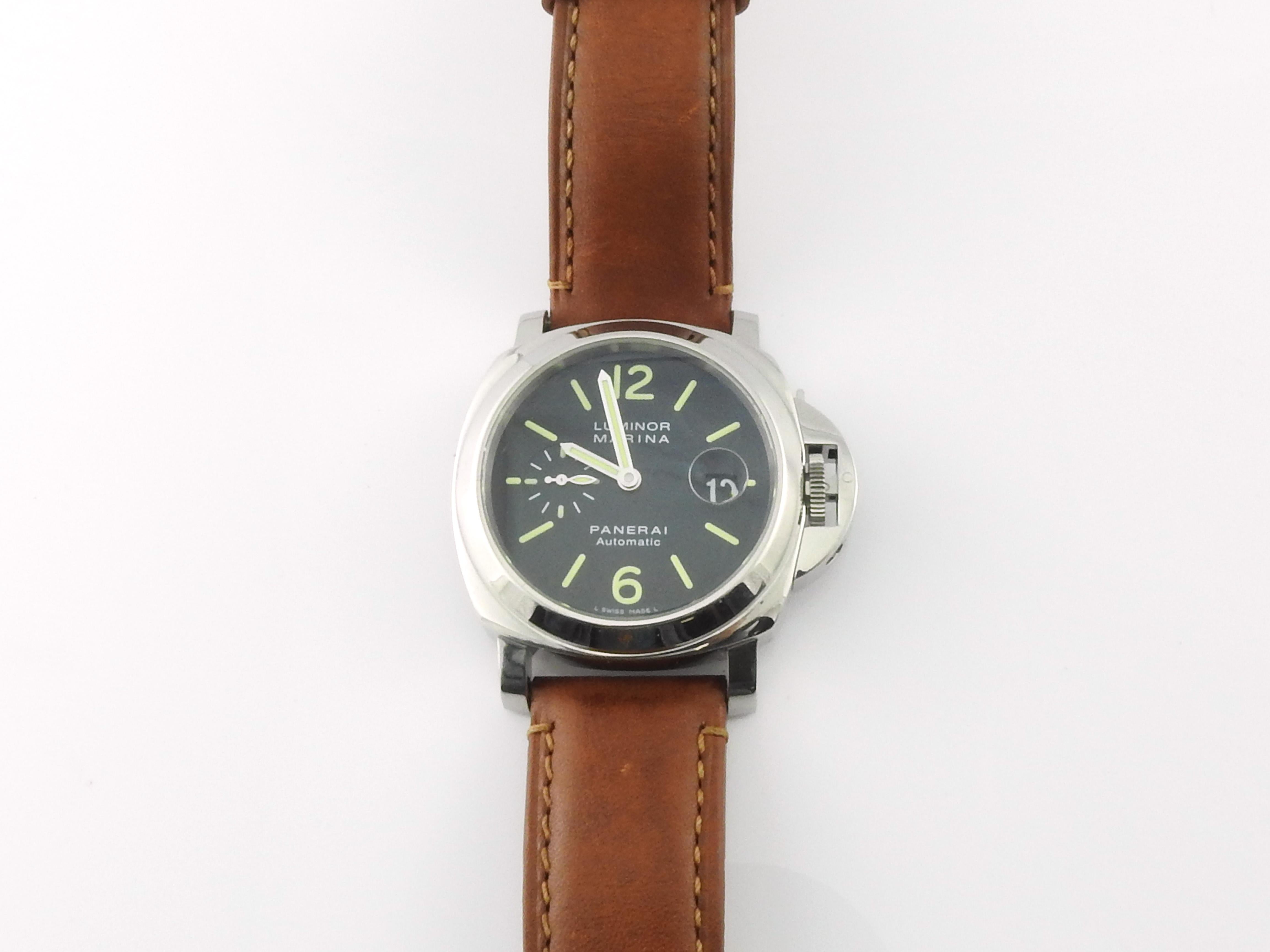 Panerai Luminor Marina Men's Watch PAM 104

Model: OP 6693
Serial: BB 1280455
K2049/6500

Stainless steel case is 44mm

Black Dial luminescent markers

Panerai Leather band with stainless steel deployment clasp

Automatic Movement

Very good