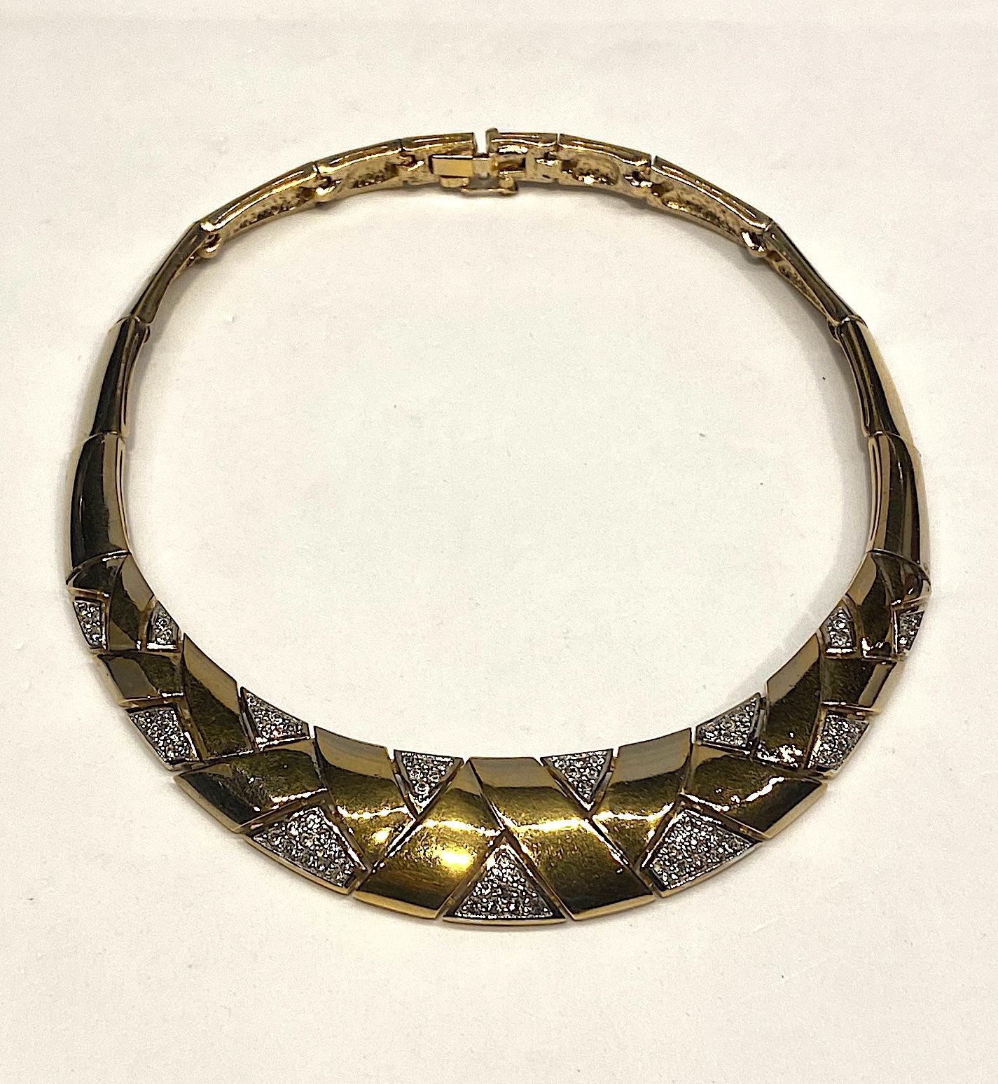 Panetta Art Deco style necklace from the 1980s in a rich gold plate with rhinestone accent. The collar is graduated with the a front piece 3.75 inches wide and .88 of an inch high. The following links gradually taper to .38 of an inch at the back