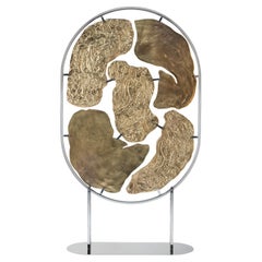 PANGEA ASYM, contemporary screen in gold plated cast metal, stainless steel base