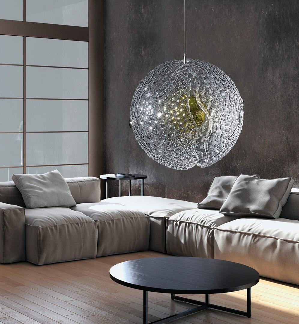 Two continents separate to reveal a shining core.
Glowing beneath the transparent crust of purest crystal,
the light is refracted through thousands of facets, to cast a stunning light.

Pangea pendant light is handmade of two hemispheres of the