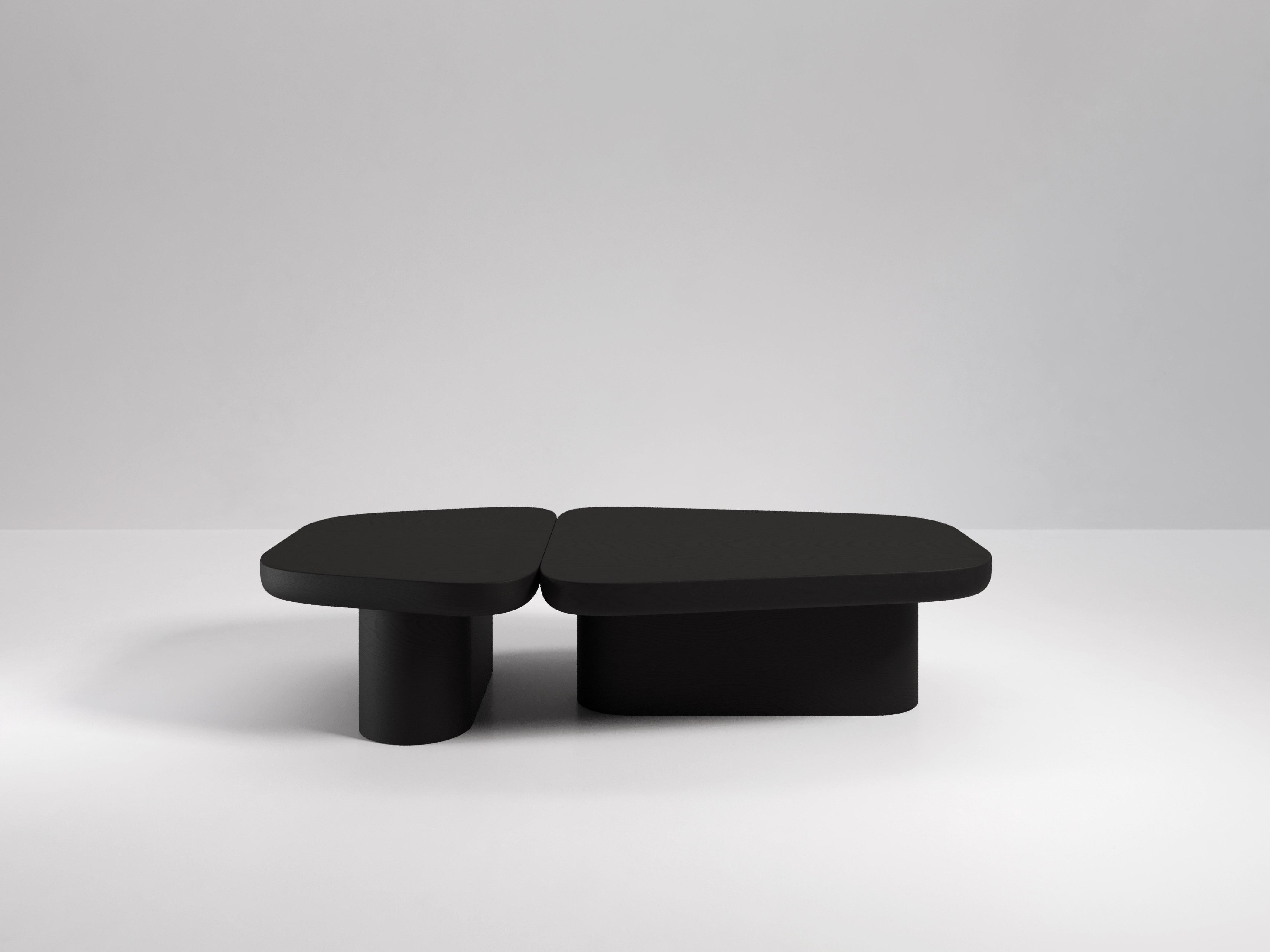 Two coffee tables with only one leg each make up the Pangea Coffee Table. It’s monolithic forms make it a fascinating and eye-catching addition to any room. The tables support each other in a way that would not be possible if they were apart, giving