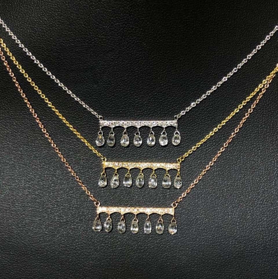 PANIM 1 Carat Chic Diamond Drop Style Necklace in 18K Gold

1ct Dripping Diamond Necklace, a ready to wear 16 inches chic Diamond Necklace set with small round diamonds and drippling briolette diamonds approximately total weight of 1cts diamond set
