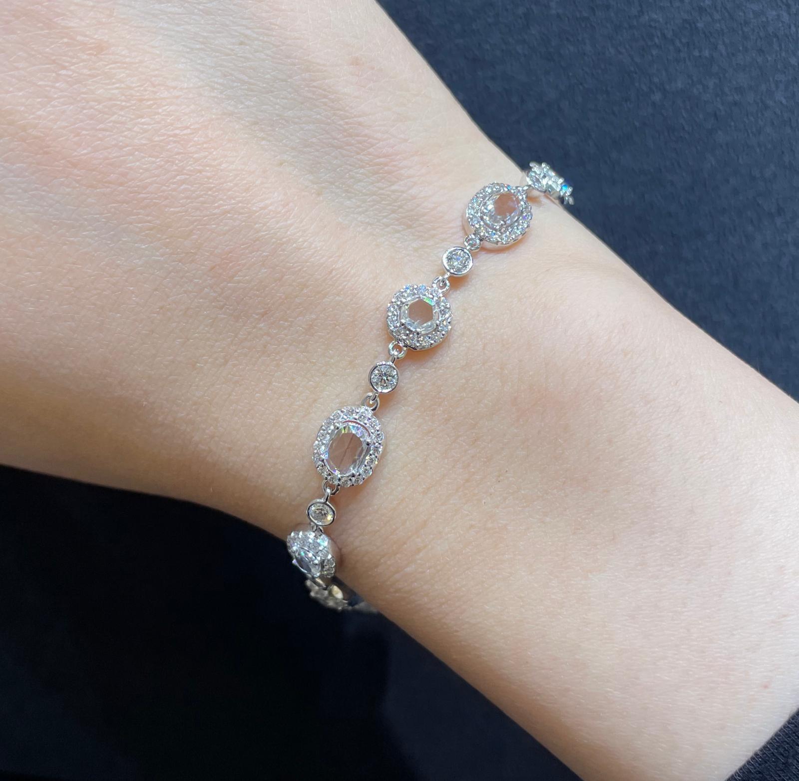 Every cluster in this bracelet is a wonder to behold, sparkling with iridescent whites, a look that can only be achieved by diamonds. A jaw-dropping 4.18 carat of Rosecut Diamonds are pave set within 18K white gold to make a truly exceptional piece