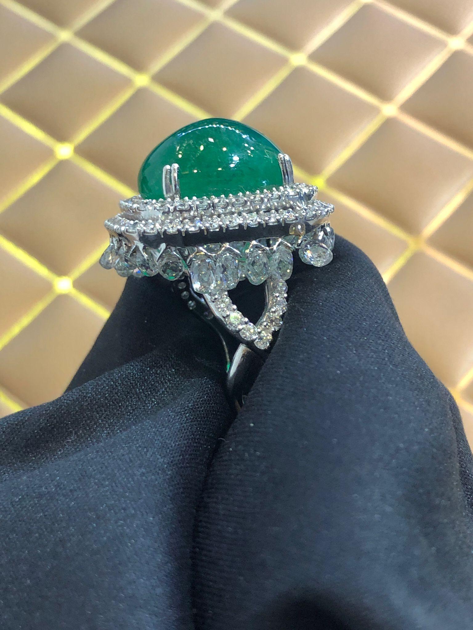 PANIM 18k White Gold Dangling Briolette Diamond & Emerald Ring 

Inspired by the beauty of a rain drop, Our Briolette Dangling diamond ring is an absolute show-stopper. It has dangling White Diamond Briolettes with big cabochon Emerald as a center
