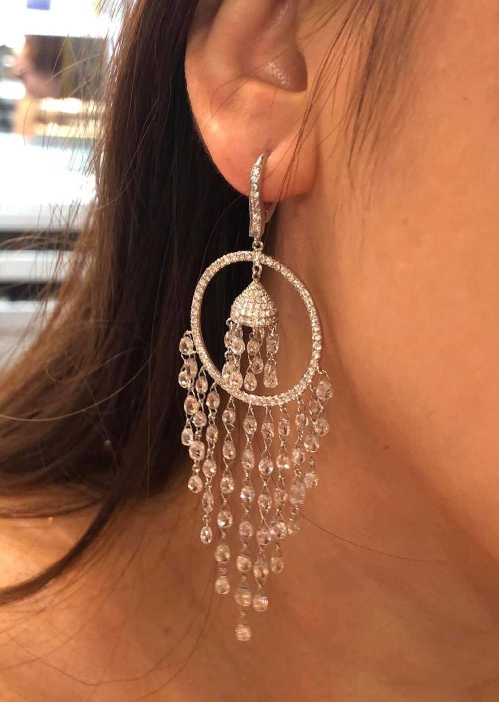 PANIM 19.81 Carat Diamond Briolette 18k White Gold Drop Earrings

A pair of drop diamond earrings, designed as a round brilliant-cut diamond set open circle with briolette-cut diamond tassels, with a total diamond weight of 19.81ct, mounted in