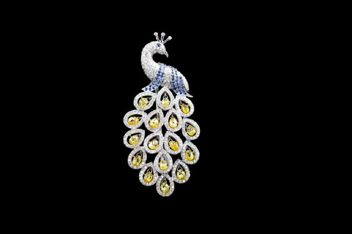 PANIM 3.75 Carat Fancy Color Diamond Briolettes 18k White Gold Peacock Brooch

Beautifully created by our artisans ,this brooch features natural fancy color diamond briolettes as the peacocks feathers and blue sapphire as its eyes .