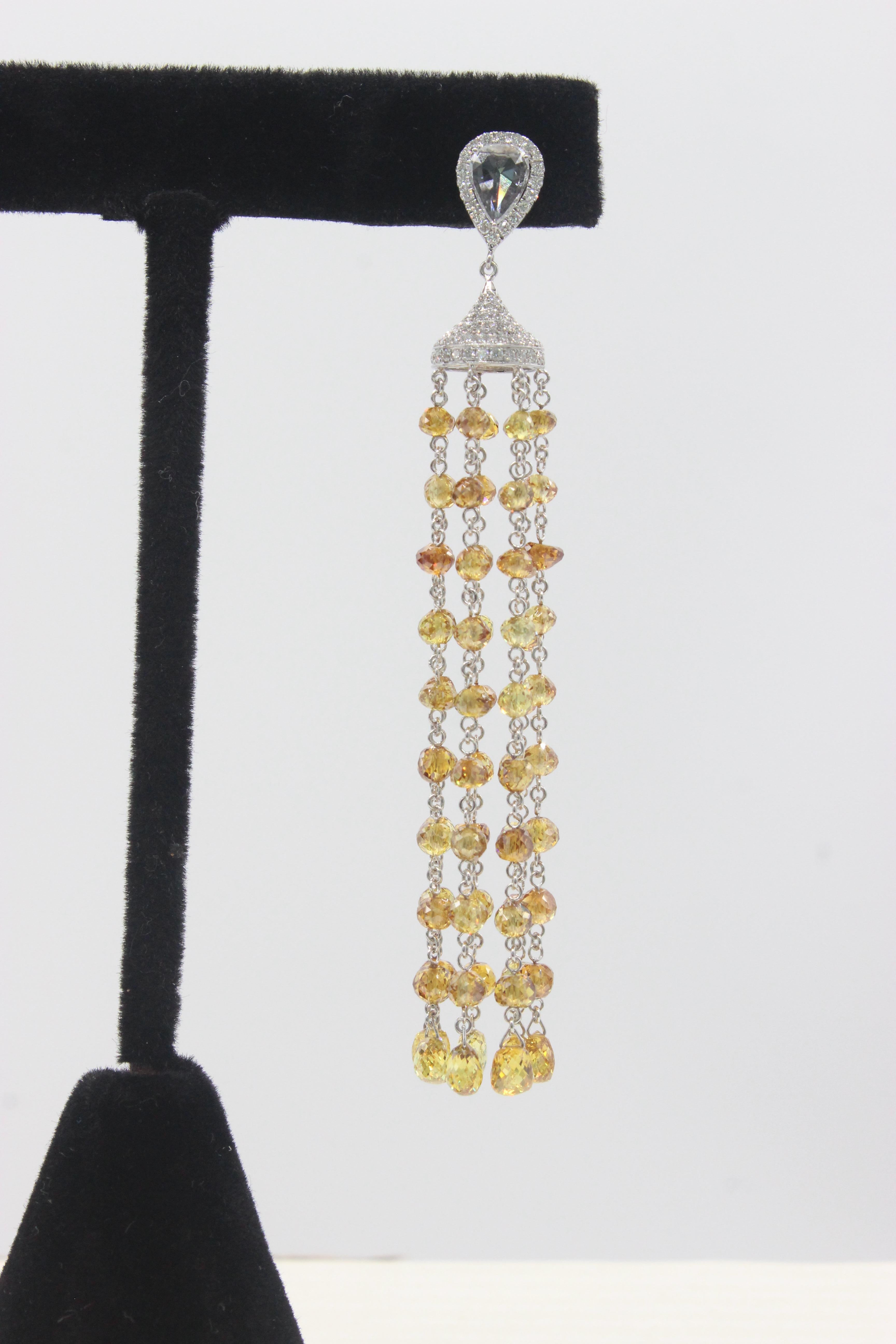 PANIM  40cts Fancy Color Diamond Beads Cocktail Earrings 18K White Gold

These Panim fancy color diamond beads and briolette tassel earrings are a stunning addition to any jewelry collection. The earrings feature a dazzling array of fancy color