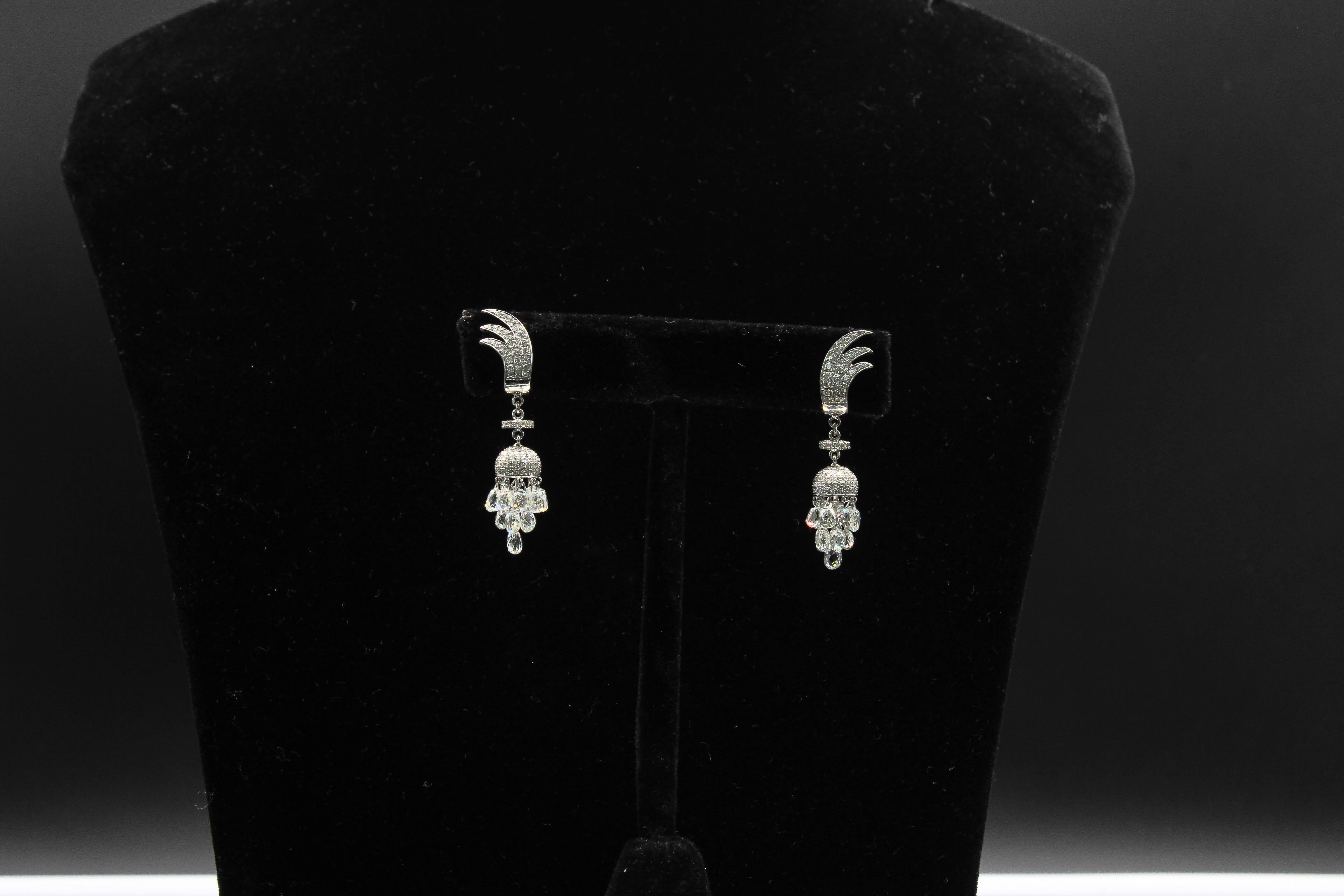 PANIM 7.46 Carat 18K White Gold Miniature Drop Diamond Earrings

Add a spice to your day to day wear with our Miniature Drop Earrings where you flaunt your dangling earrings set with drop shaped diamond and fine round brilliant cut in 18K White