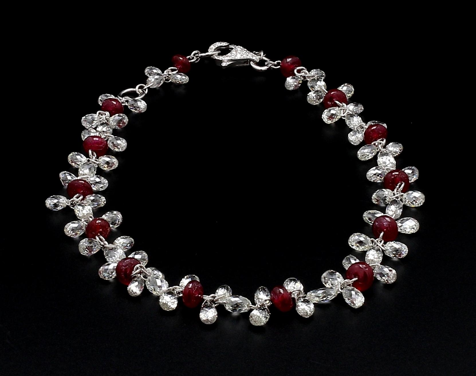 PANIM Diamond Briolette & Ruby 18K White Gold Dangling Bracelet

Bracelets are worn to enhance the look. Women love to look good. Women often wear exquisite gold bracelets on their wrists, and this is quite usual. Every woman should own a diamond