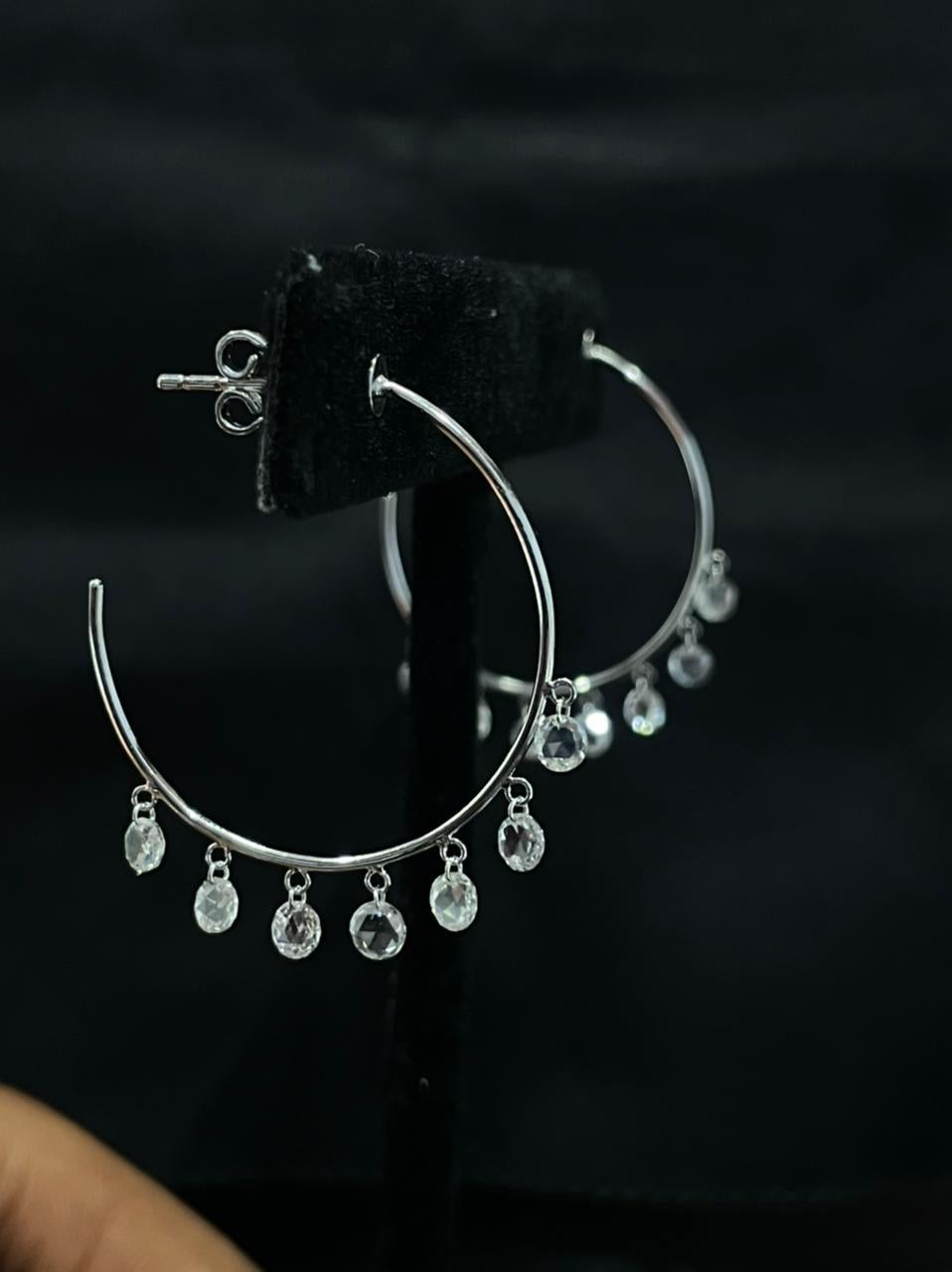 PANIM Diamond Rosecut 18k White Gold Hoop Earrings

Elevate your attire and make a statement with the sparkling diamond hoop earrings to boost your everyday look. Up your hoop game by adding pendants and make it truly personal. Set in 18ct white