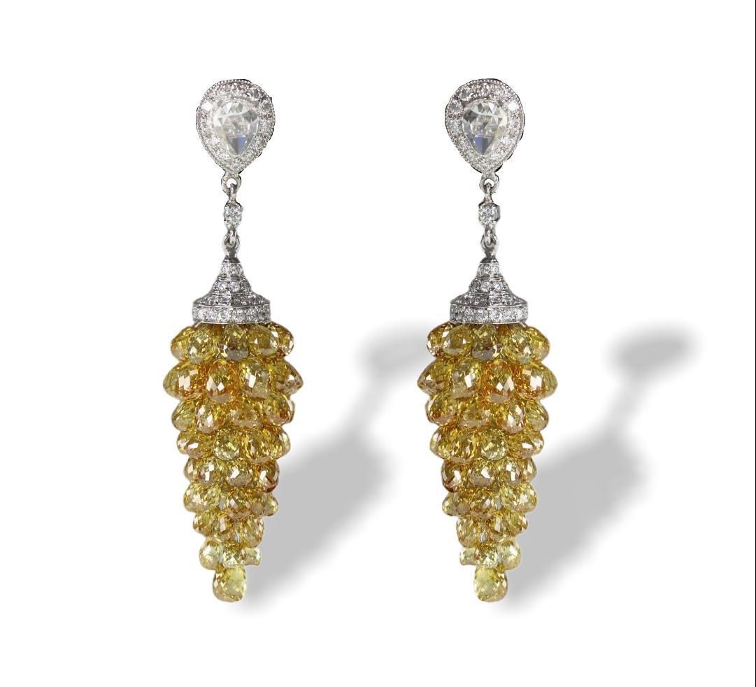 PANIM Fancy Color Diamond Briolette 18k White Gold Drop Earrings

Unique handcrafted Natural Fancy Color Diamond Briolettes Grape Style earrings.

Natural Fancy Color Briolettes ranges from Golden Yellow to Fancy Yellow with multi tone yellow