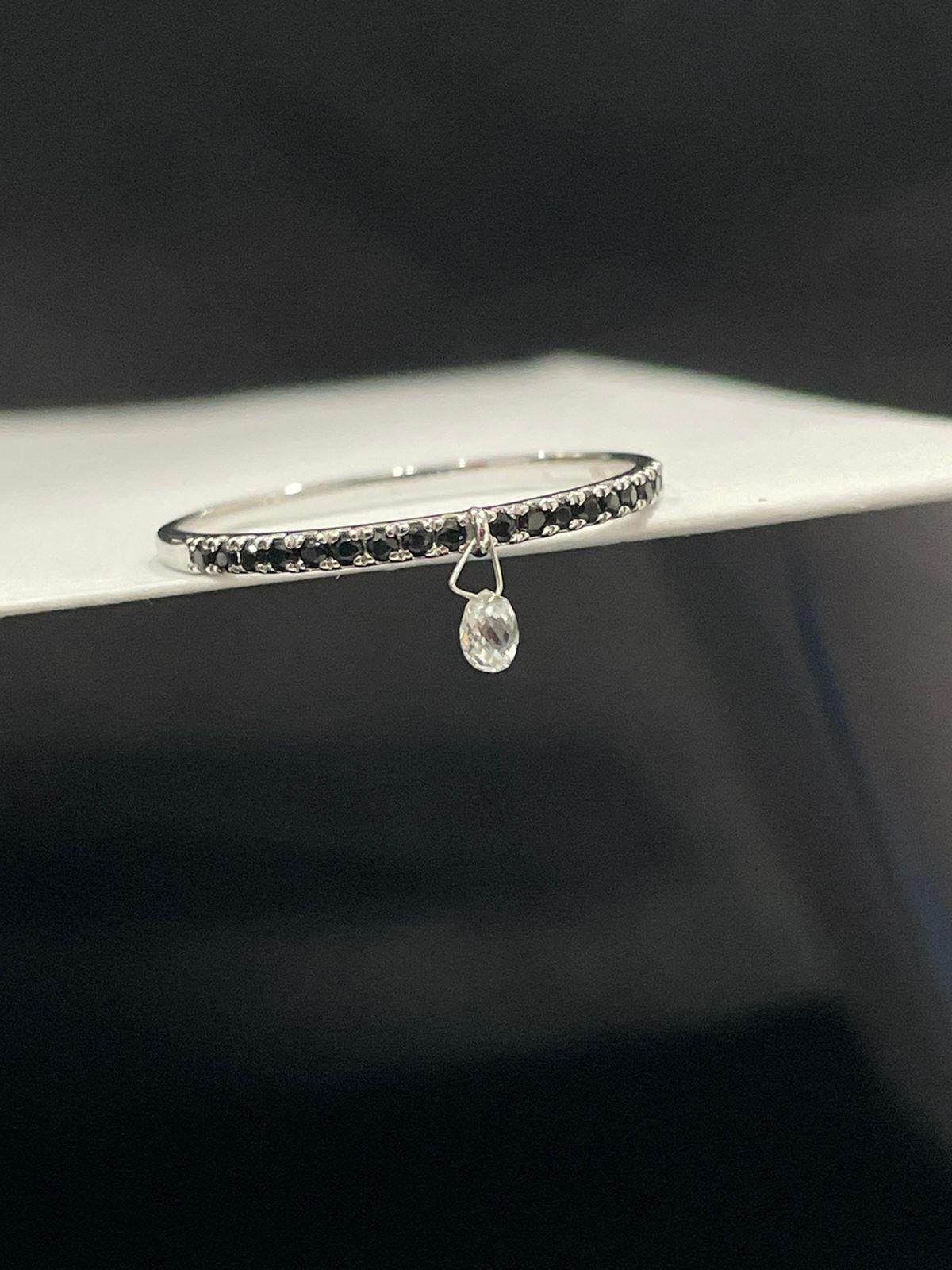 PANIM Mono Briolette Diamond & Black Diamond 18K White Gold Ring

Inspired by the beauty of a rain drop, Our eccentric Dangling diamond ring is an absolute show-stopper. It has 1 pieces Rain Drops White Diamond Briolette's set with black