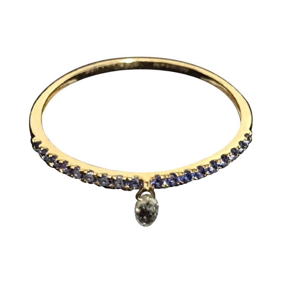 PANIM im Mono Diamond Briolette & Sapphire 18K Yellow Gold Dangling Ring

Inspired by the beauty of a rain drop, Our eccentric Dangling diamond ring is an absolute show-stopper. It has 1 pieces Rain Drops White Diamond Briolette's set with Blue