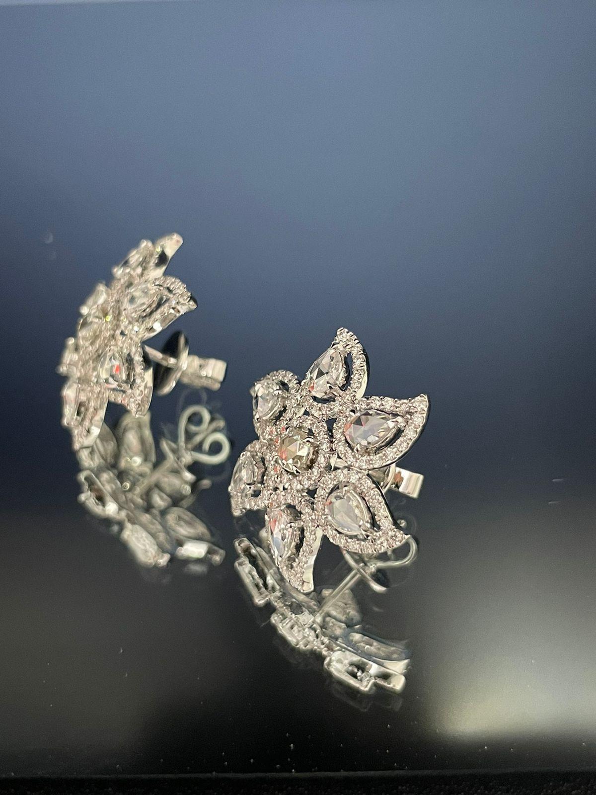Panim  Rosecut Diamond Flower Earrings 18 Karat White Gold

These stunning fancy rosecut diamond Flower earrings are One of a kind and handmade.

They are crafted in 18kt white gold, this pair of Stud earrings features a fancy Rosecut 2.28 carat of