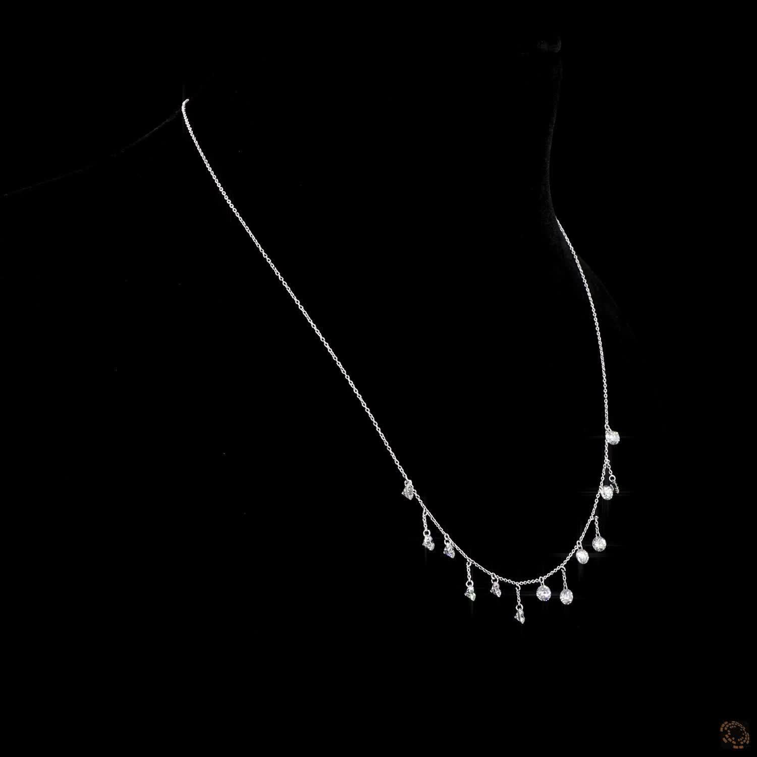 PANIM 3.25cts Round Dangling Necklace in 18Karat White Gold

Very close to each other, the thirty-one suspended diamonds that adorn this necklace exchange their reflection and their brilliance.
The thin, shiny chain gives this creation a discreet