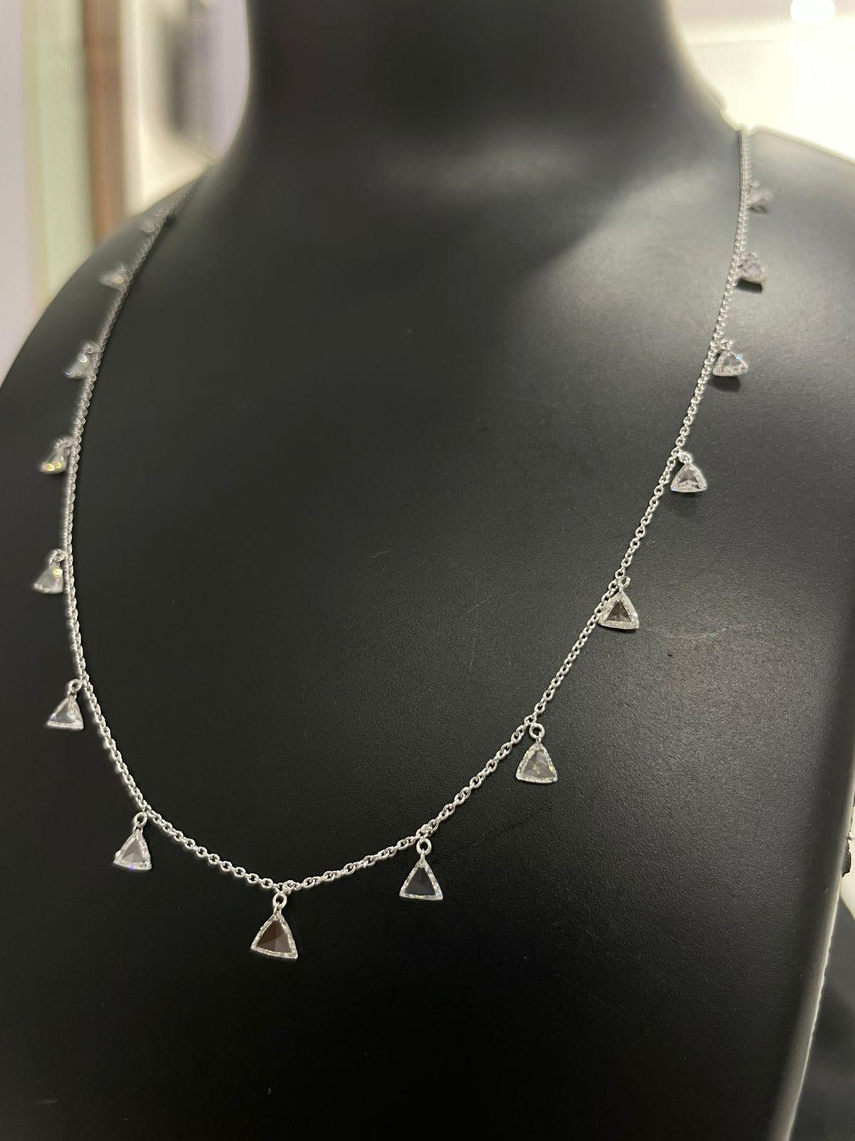 PANIM  Triangle Diamond Rosecut 18k White Gold Dangling Necklace

This unique choker necklace is suspended on an 18K fine gold chain by a total of two carats of dangling triangle-shaped diamond rosecuts. This exquisite rosecut necklace gives your
