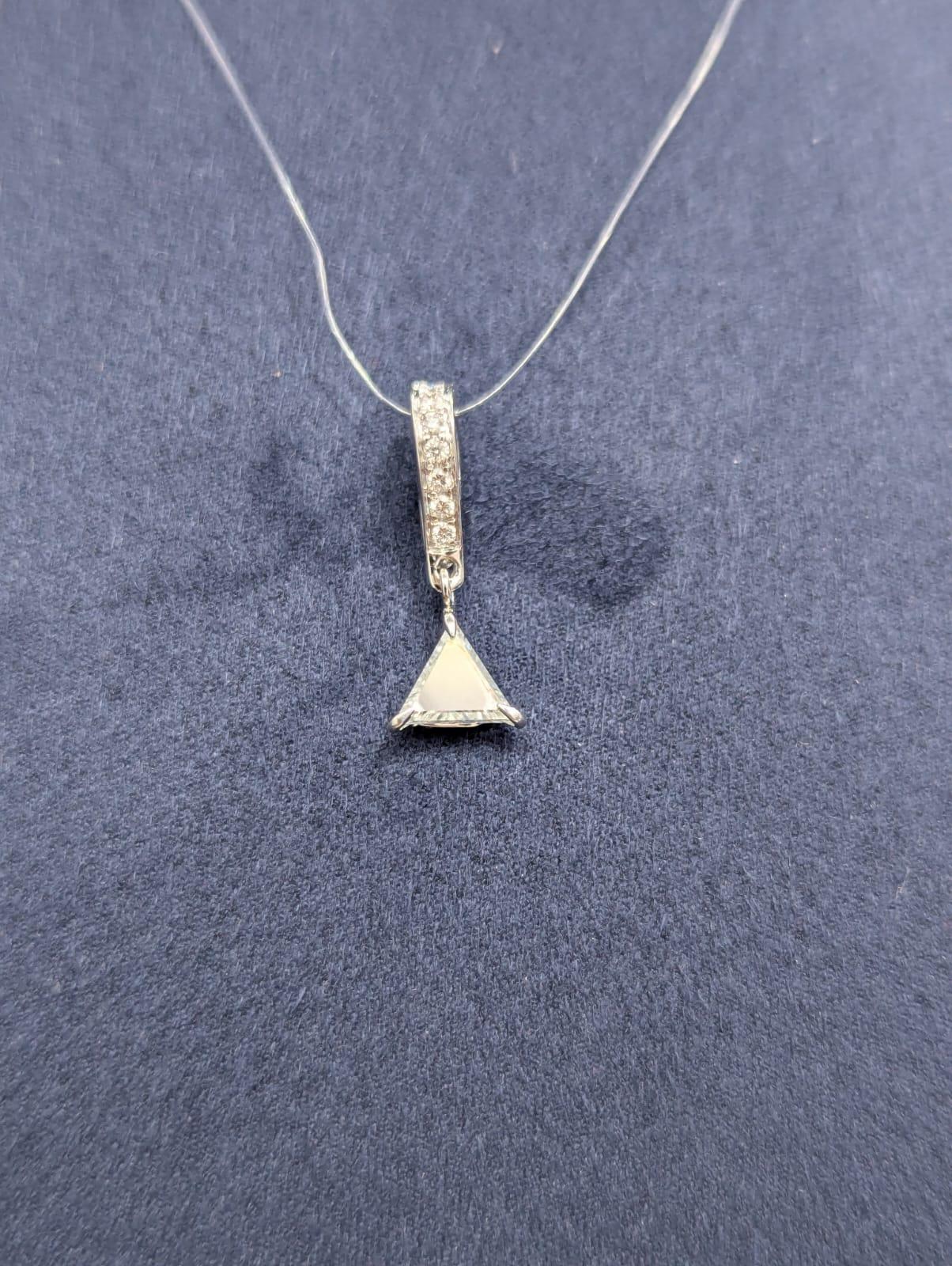PANIM Triangle Portrait cut Pendent in 18K White Gold

Every Bead  cut diamond on these Tringle Diamond Pendent is carefully drilled by our skilled artisans. The outcome is a unique piece of luxurious jewelry that creates the illusion of diamonds
