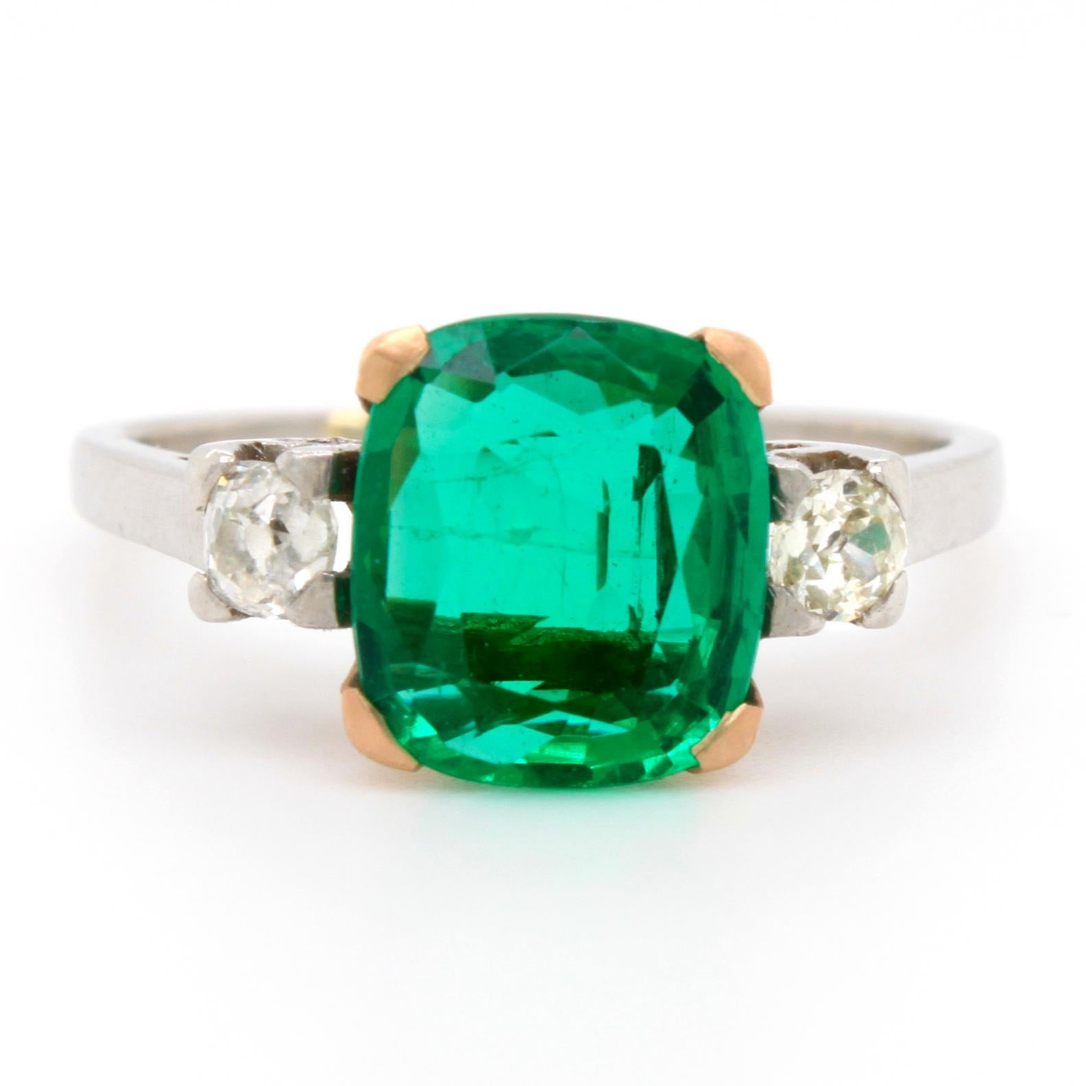 A rare emerald, from the Panjshir valley in Afghanistan, and diamond ring in yellow and white gold. The emerald weighs 2.15 carats and is accompanied with a gemological certificate by DSEF stating that the emerald is from Afghanistan and has minor