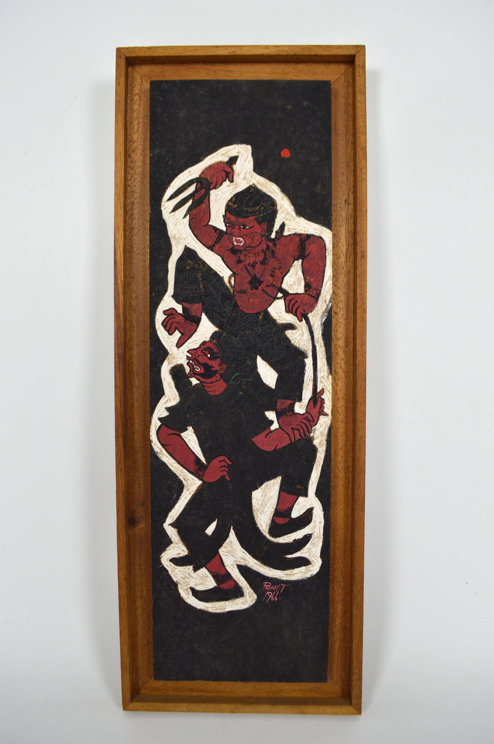 Wooden panel painted in black, red and white tones.
The painting represents a Hindu mythological scene: we see Hanuman, the Monkey God, fighting against a demon.

Signed and dated: 