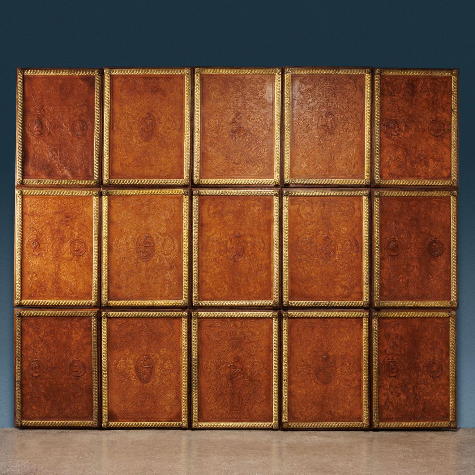 Series of 15 leather panels mounted on walnut frame and framed by gilt bronze frames; these are composed of a bundle held by a ribbon of rope and concluded in the corners by rosettes. The panels, worked by impression, are decorated with grotesque