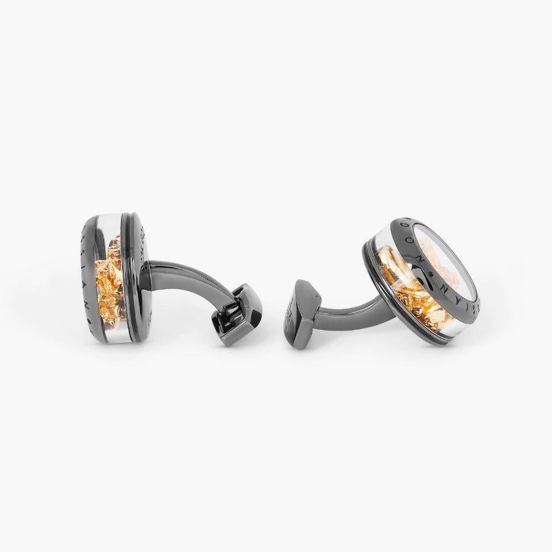 Panorama Precious Gold Leaf cufflinks in gunmetal finish

Pure gold is the oldest form of beaten metal, dating back to Ancient Egyptians. Gold is converted into extremely thin leaves using a hammer, requiring precision of the eye and control when
