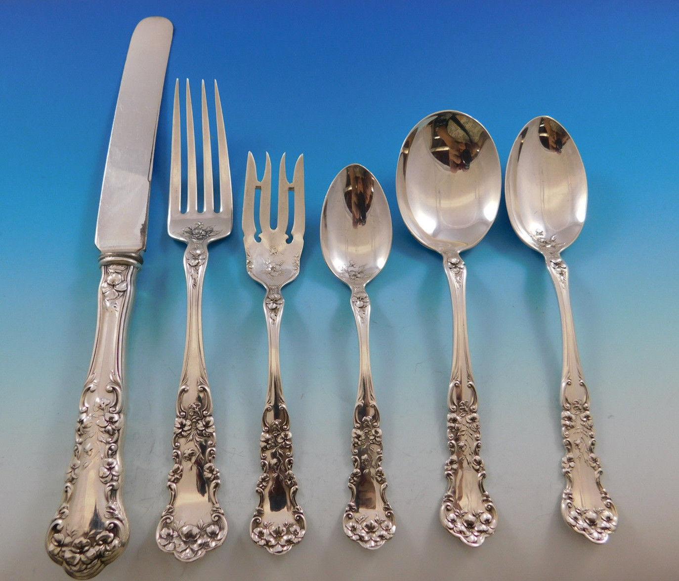 Dinner size pansy by International circa 1909 sterling silver flatware set, 50 pieces. This set includes:

Eight dinner size knives, blunt plated blades, 10