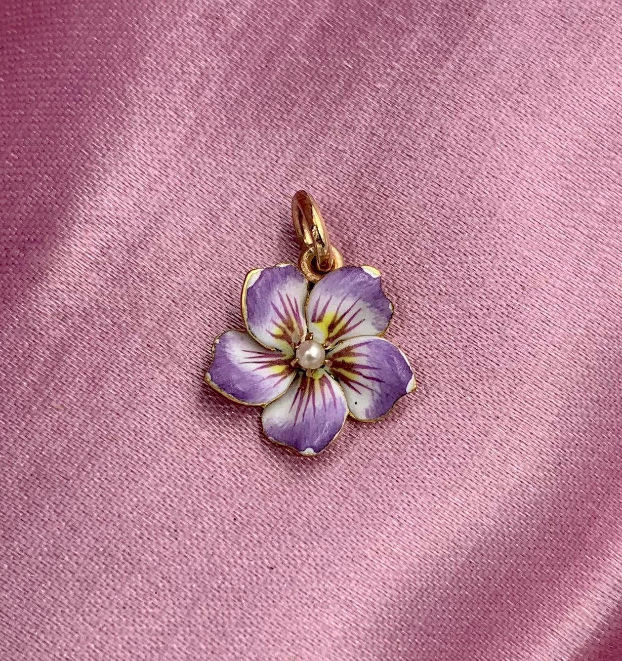 A VICTORIAN - ART NOUVEAU ENAMEL AND 18 KARAT GOLD LAVALIERE PENDANT IN THE FORM OF A PANSY FLOWER .  THE PENDANT IS SO STUNNING WITH THE MOST DELICATE MULTI-HUED PURPLE LAVENDER ENAMEL OF THE HIGHEST QUALITY SET WITH A LOVELY PEARL IN THE BEAUTIFUL