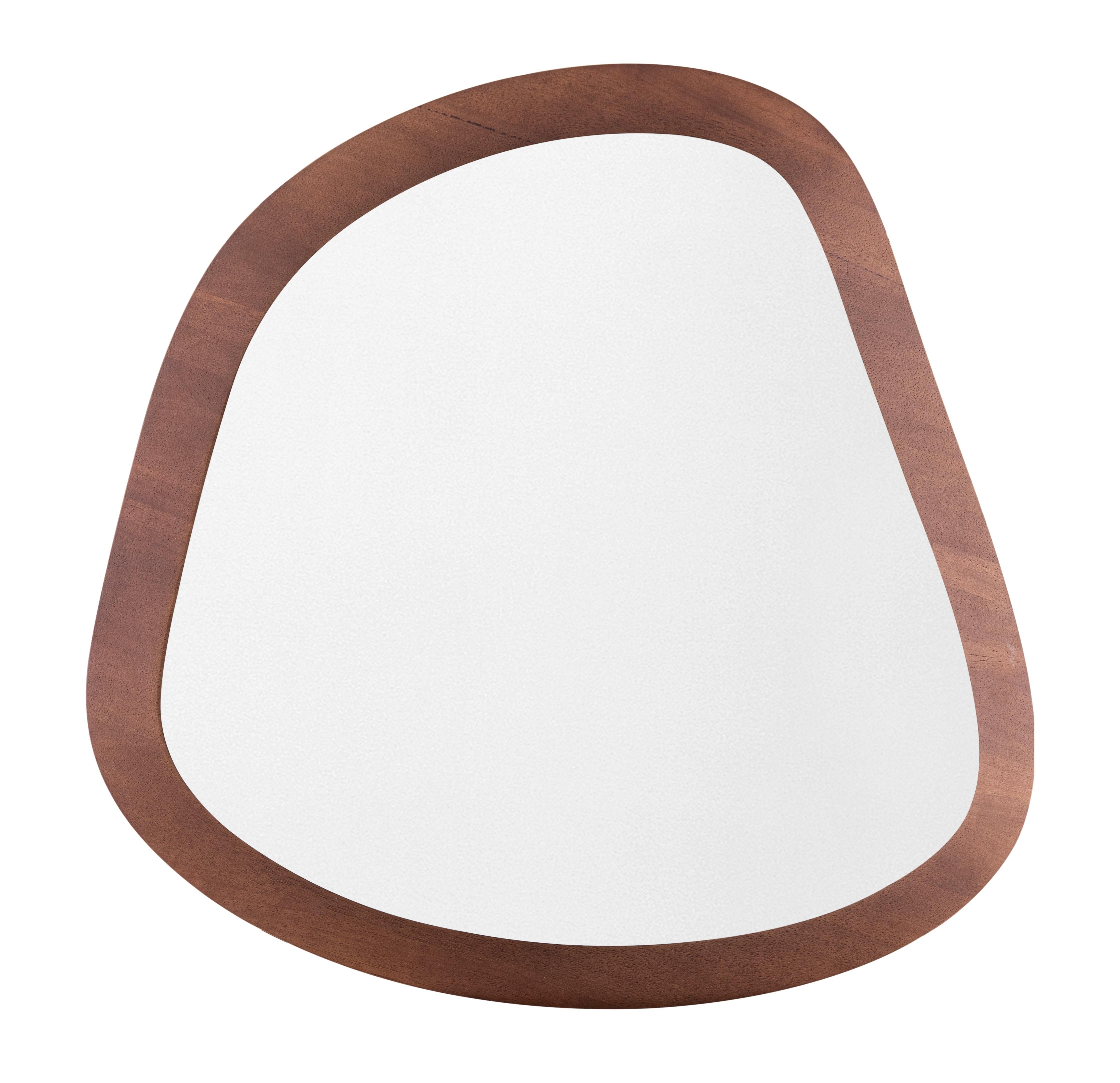 The organic shapes that form the Pantê series of mirrors are inspired by the pattern of spots seen on a jaguar’s coat. The woodwork design frames the mirror, incorporating elements of nature into the home. The solid wood of the frame incorporated