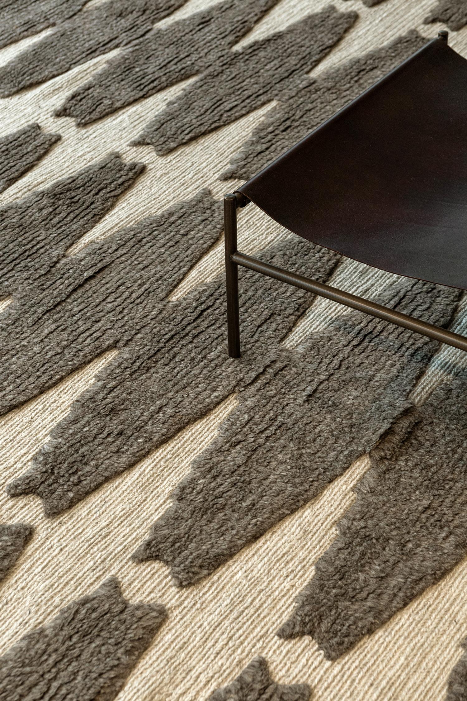 Pantera features an all-over cocoa brown lozenge motif on an ivory field. The textural contrast of embossed pile and flatweave ground delights the foot. Refined design is matched with vivid tonal palettes in the Michael Berman Collection. These are