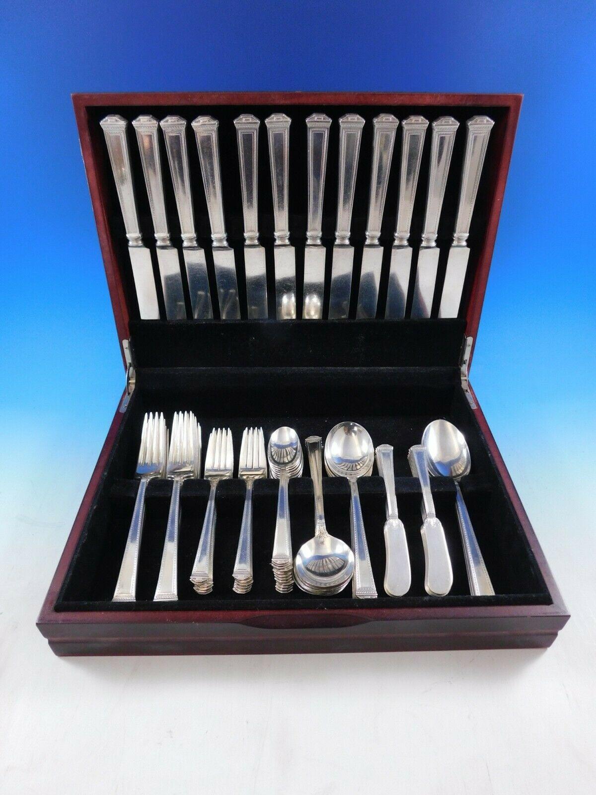 Dinner size Pantheon by International sterling silver flatware set, 75 pieces. This set includes:


12 dinner size knives, 9 3/4