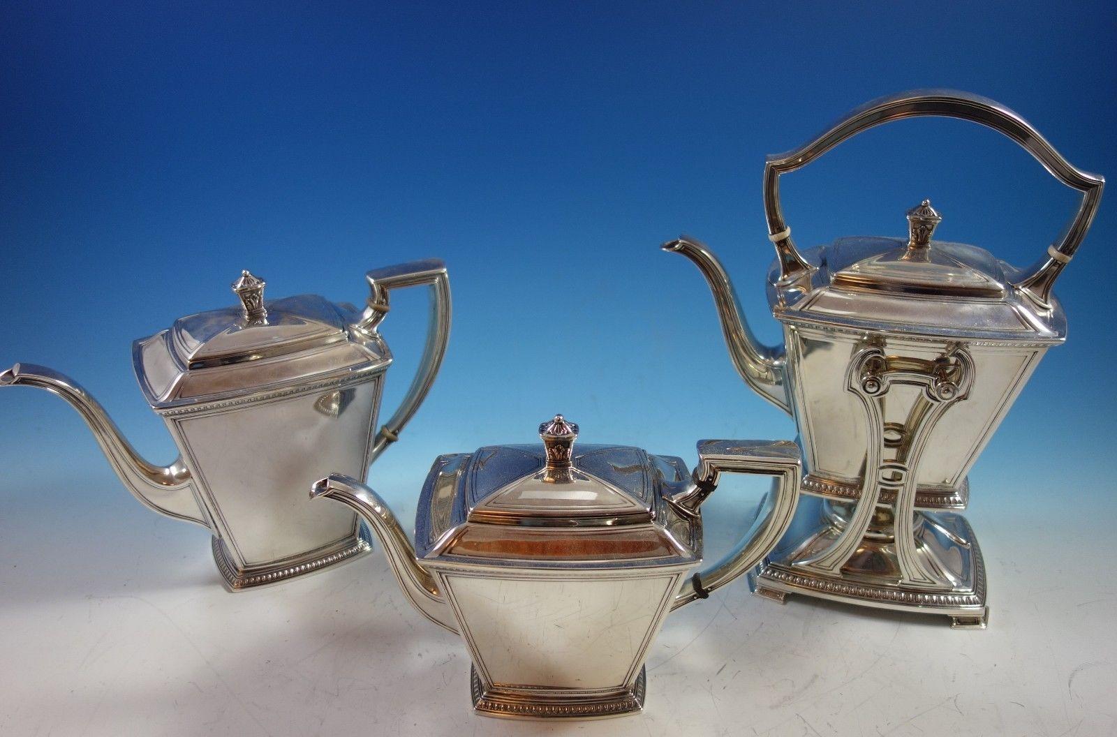 Superb Pantheon by International sterling silver 5-piece tea set with tray. 

This set includes: 
1 - Kettle on stand: Marked with #5600-8, it weighs 49.63 ozt., and it measures 12 1/2 x 9 1/4 . 

1 - Coffee pot: Marked with #5607, it weighs 27