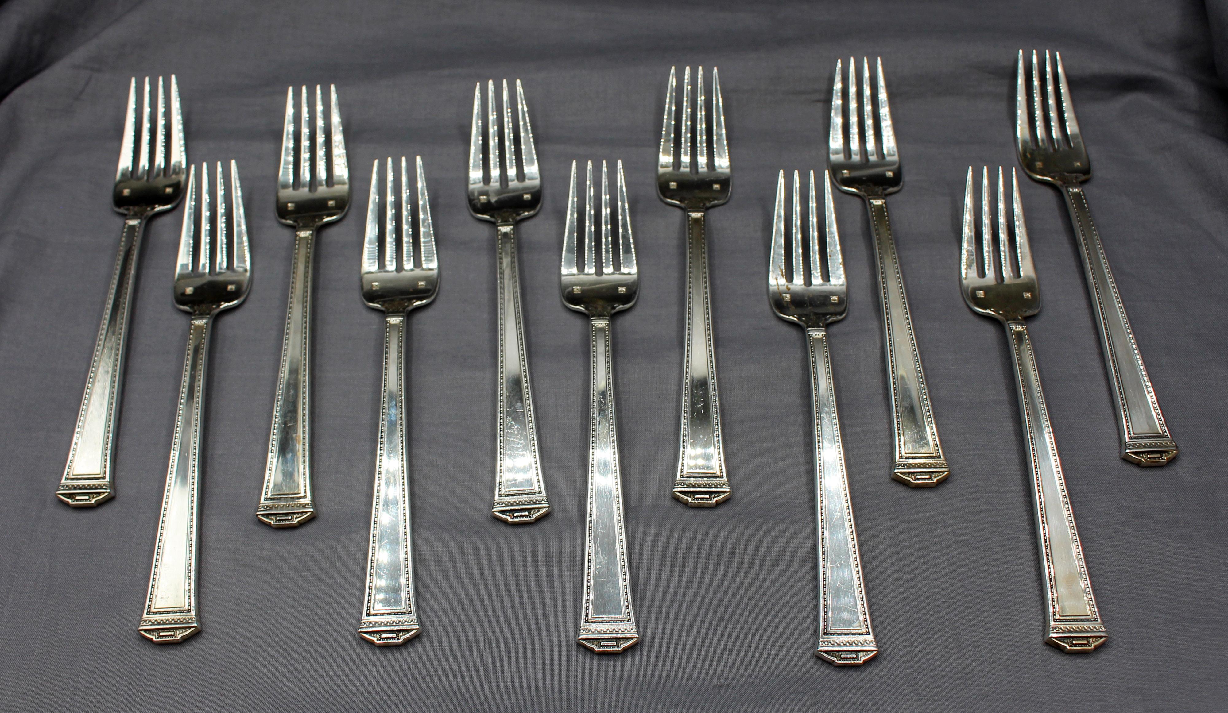 2001-2009 57 pc. set of sterling silver flatware, Pantheon pattern by Tuttle, American. Includes: 12 dinner knives (9.75