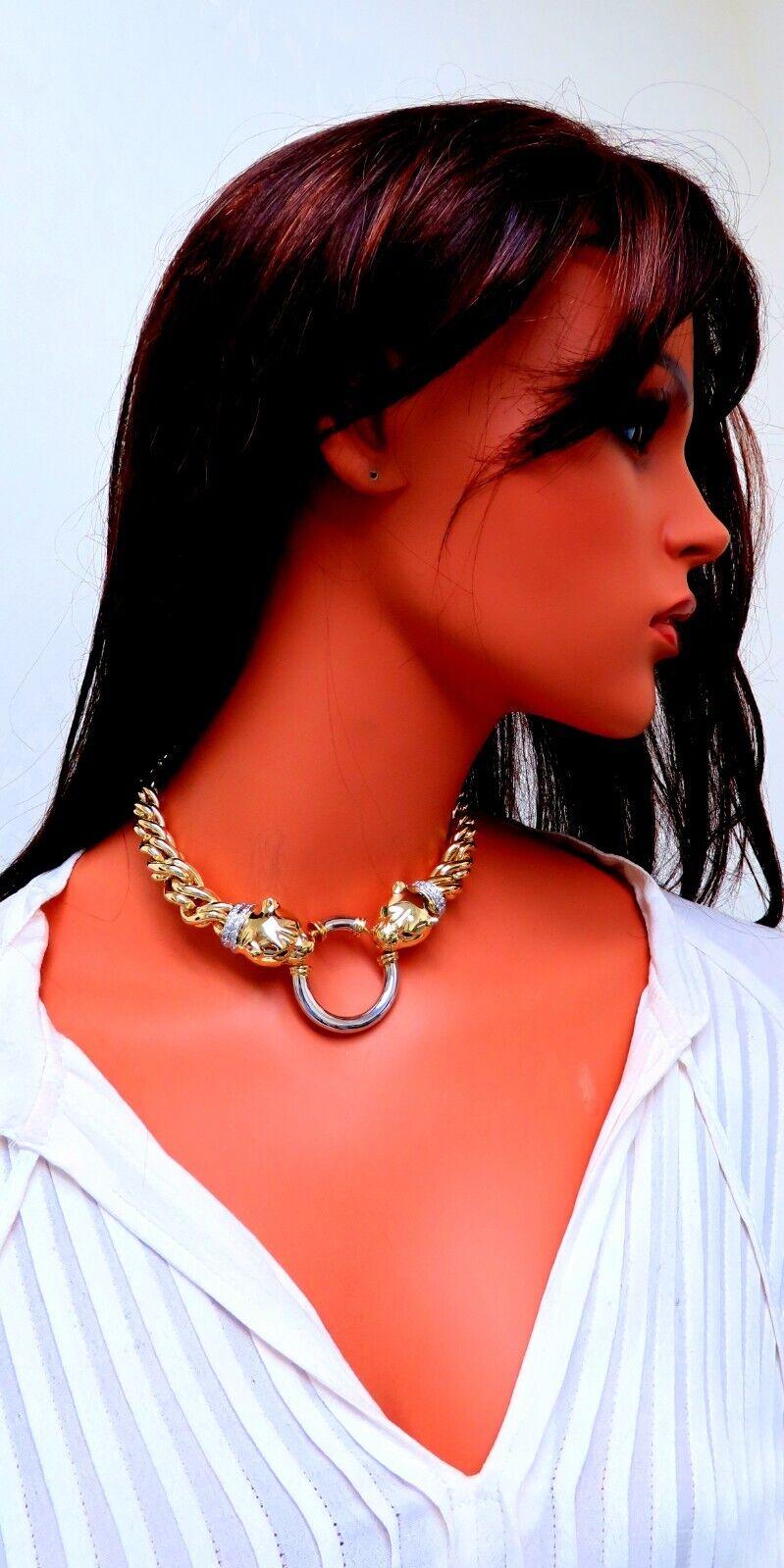 Twisting Link Diamond  Necklace 

 .90ct. Natural Round Shape Diamond

Vs-2 clarity, G-color

.24ct natural emeralds 

14kt. Yellow Gold Necklace of 14.5 inches

Chain Caliber: 13-7mm

Panther Head 19 x 19mm & 15mm depth

38mm ring

108