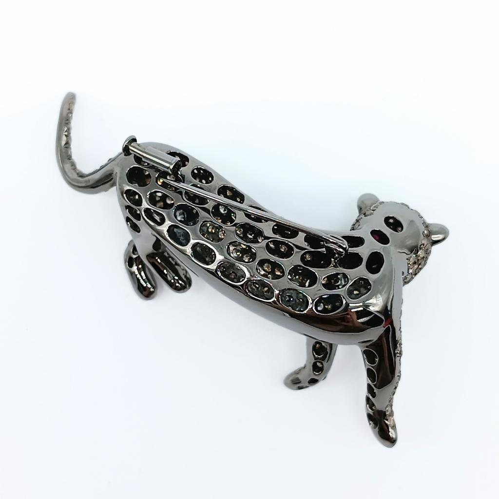 Brilliant Cut Panther Brooch with Diamonds and Rubies For Sale