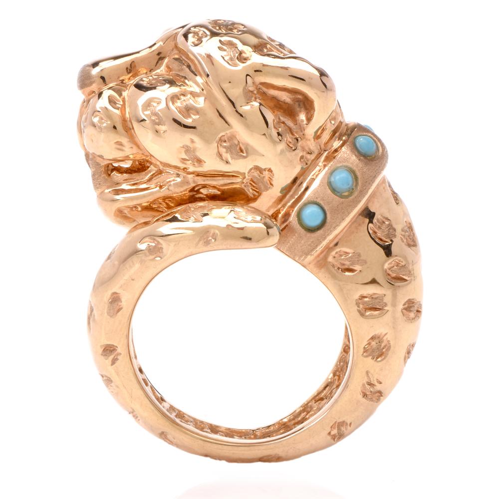 This estate panther ring with turquoise cabochons is crafted in 18-karat yellow gold weighing 6.8 grams and measuring 17mm wide x 20mm high. It depicts a profile of a panther’s head in immaculate detail, with 6 small turquoise cabochons around the
