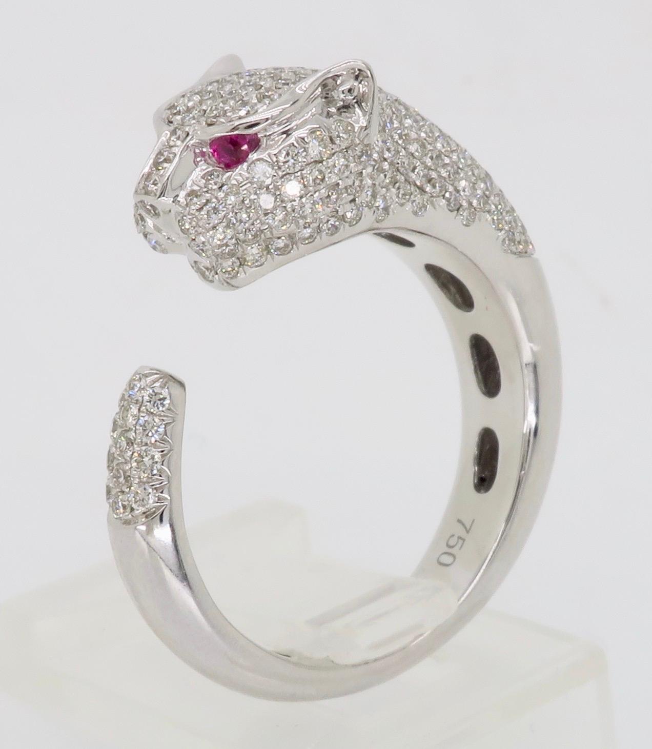 Intricate 18k white gold Diamond Panther ring made with Ruby Eyes.

Gemstone: Diamond and Ruby
Gemstone Carat Weight: .04CTW 
Diamond Carat Weight:  .80CTW
Diamond Cut: Round Brilliant Cut
Color: Average F-H
Clarity: Average VS
Metal: 18K White