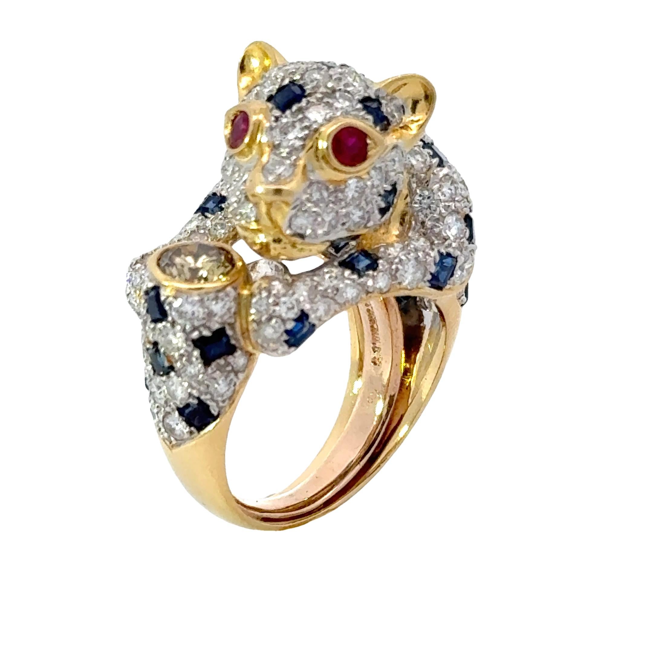 Discover the exquisite beauty of our Panther Diamond Sapphire and Ruby 18K Yellow Gold Ring. This vintage piece is even more stunning in person, showcasing a harmonious combination of diamonds, sapphires, and rubies. Expertly crafted with 18K yellow