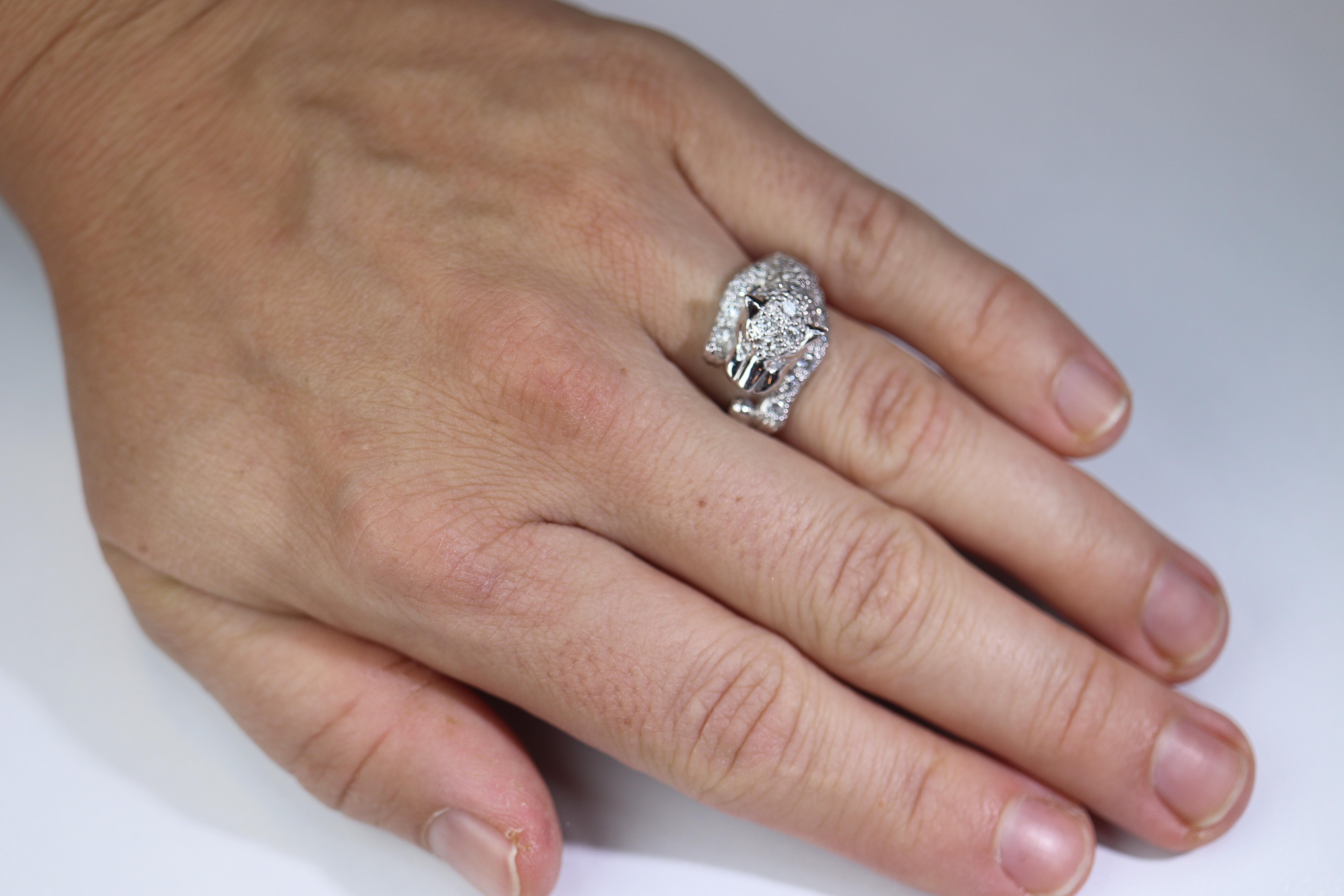 Beautiful encrusted Panther Leopard or Cheetah with Diamonds

Appraised at $4600.
Platinum PT900 Setting.
10.6grams total weight

1.10 CTW of Diamonds. SI Clarity with H-I color

Details:
Size 6
Wonderful and RARE piece.