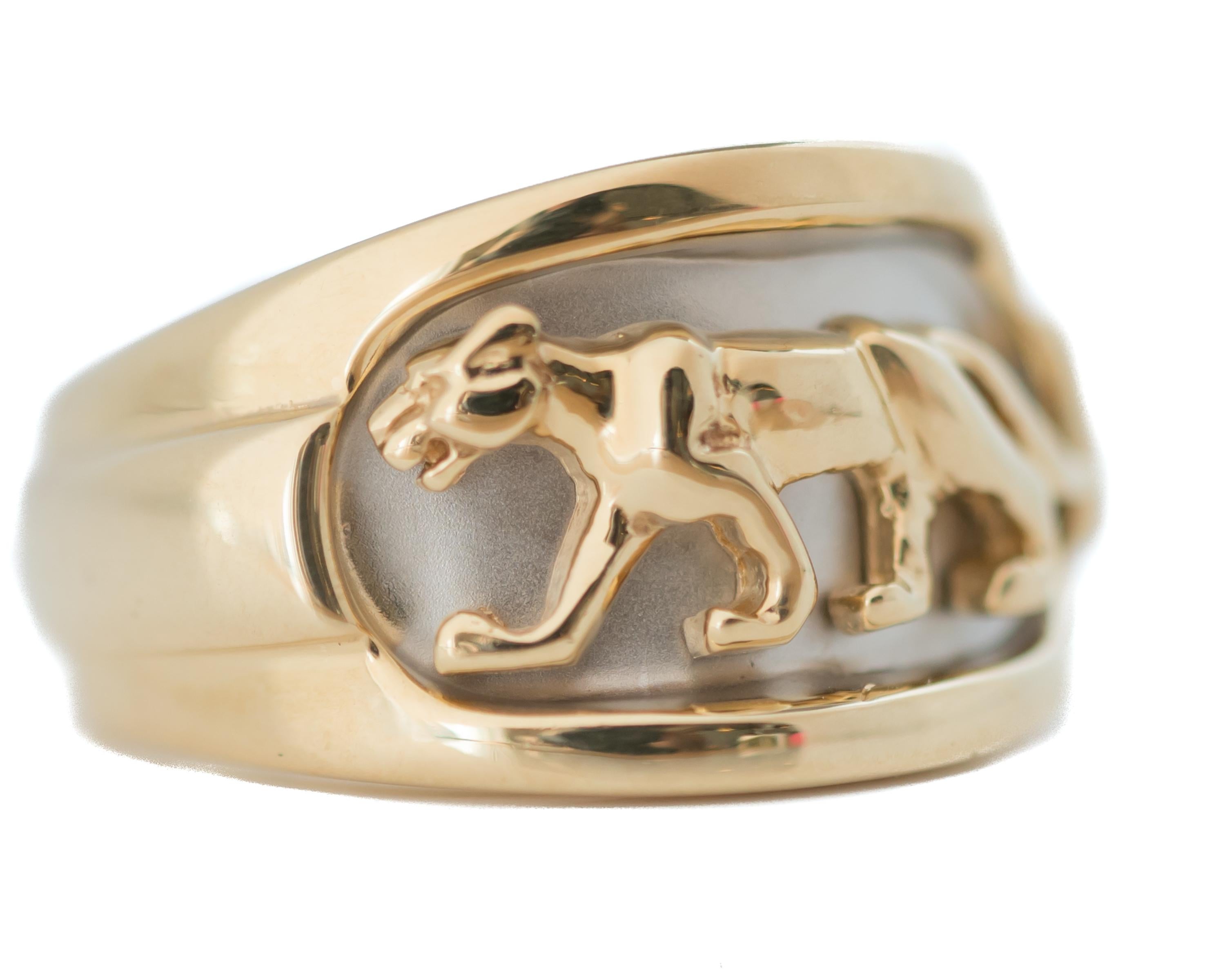 Gold Panther, Cougar Ring - 14 Karat Yellow Gold, 14 Karat White Gold

Features:
14 karat Yellow Gold
14 karat White Gold face
Raised Panther/Cougar Design
Width tapers from 12 - 5 millimeters
Finger to top of ring measures 2.5 millimeters
Ring fit