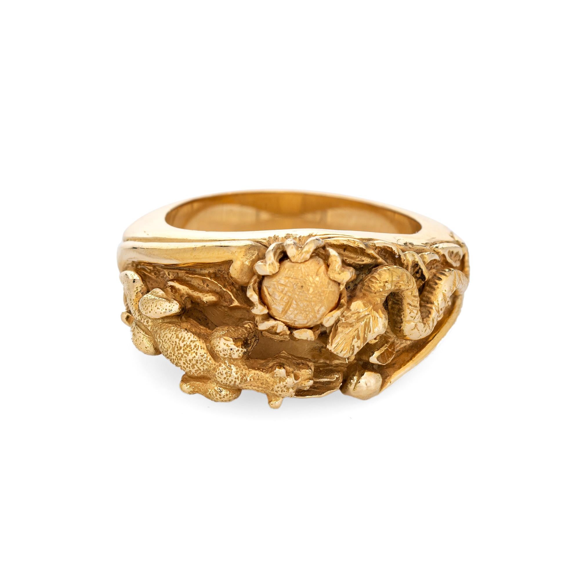 Finely detailed panther & snake ring crafted in 18 karat yellow gold. 

The elaborate and beautifully detailed ring highlights a panther perched in a predatory position to steal the eggs from the snake's nest. The coiled snake sits in a protective