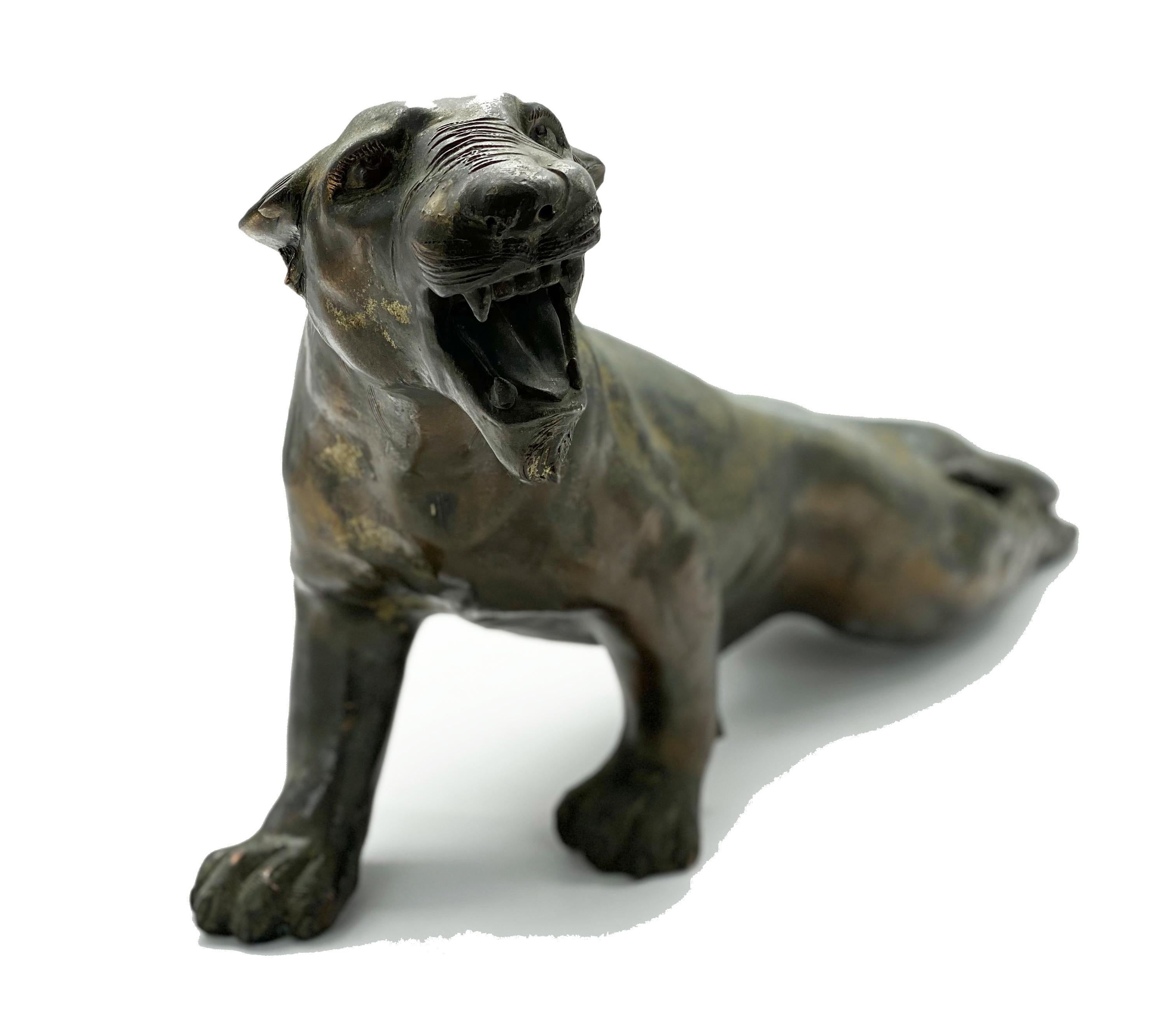 Walnut wood sculpture depicting a panther in attacking pose. The sculpture is particularly fascinating for its realistic attention to detail, which gives the animal a remarkable sense of plasticity.